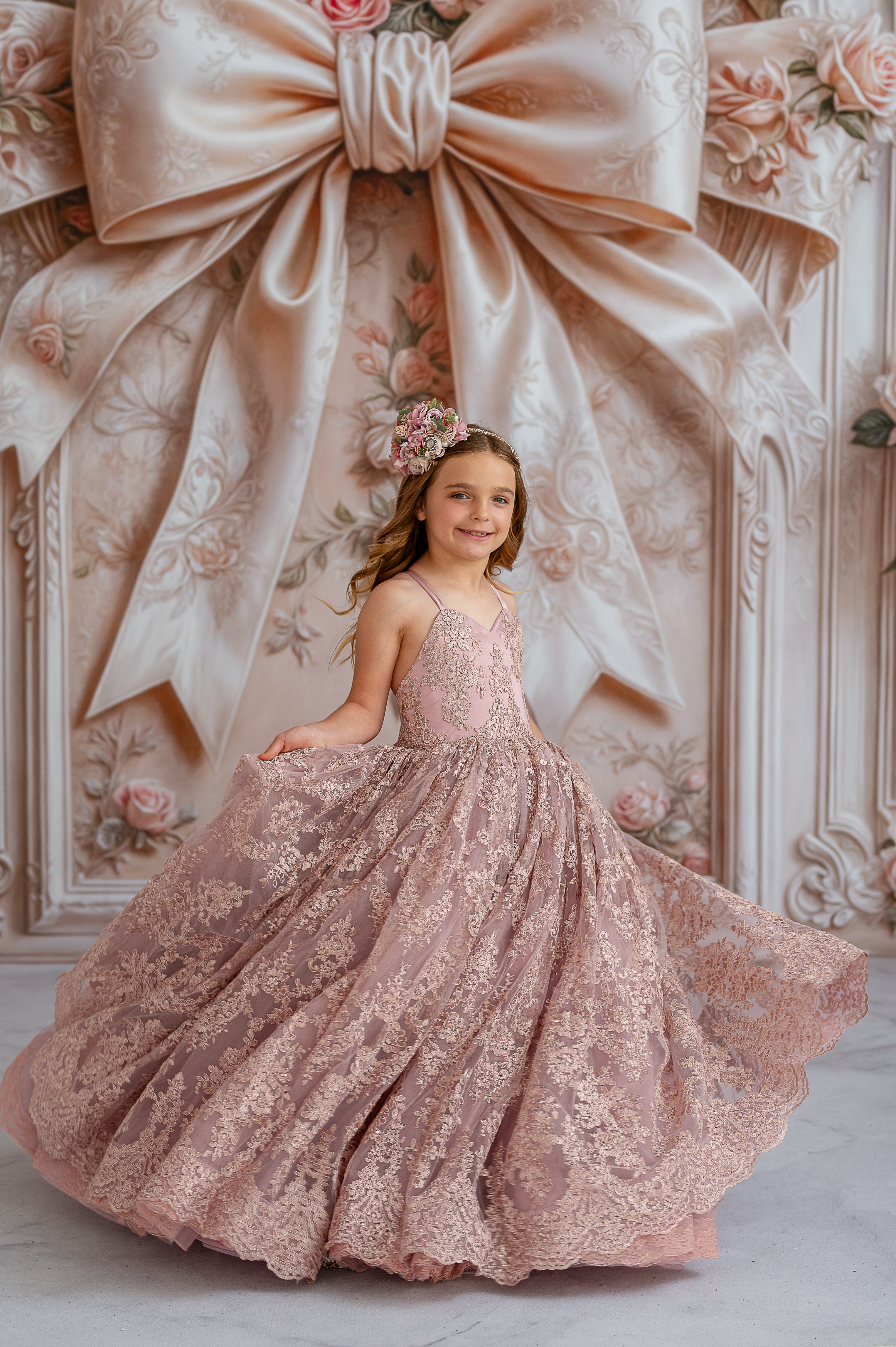 "Timelessly elegant gown with ornate lace embellishments and a classic silhouette, displayed in a studio setting"