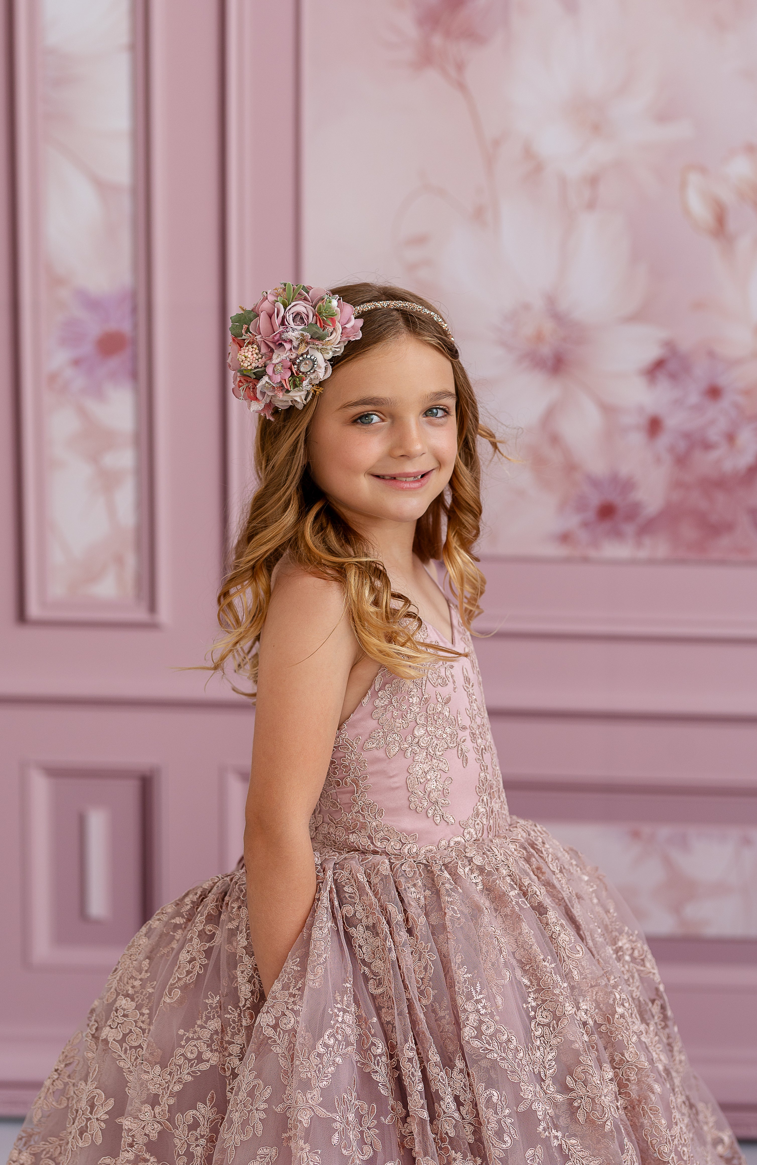 "Elegant couture dress with intricate lace detailing and subtle shimmer, displayed on a mannequin"