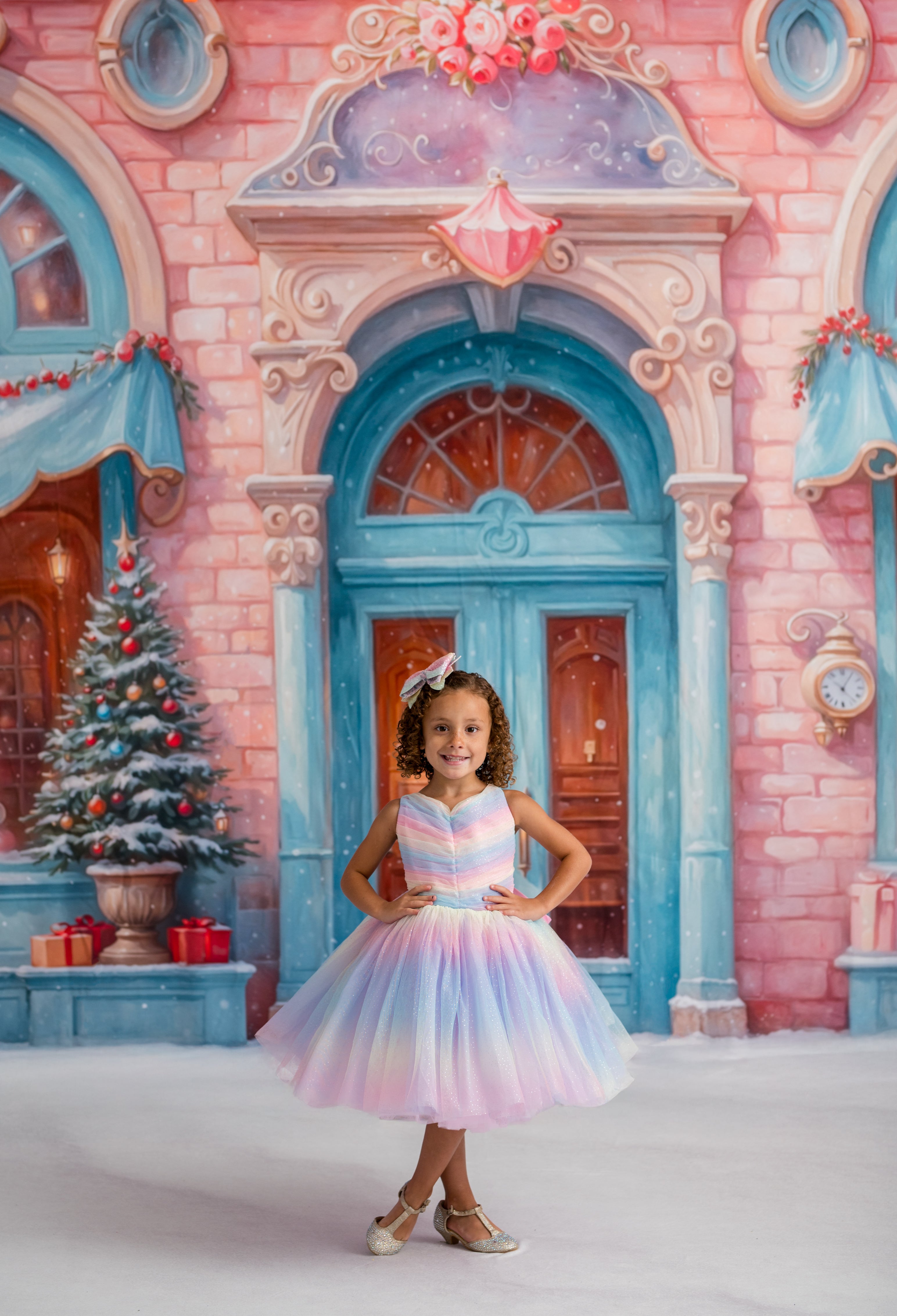 Young girl in a colorful dress standing in front of a fairy-tale castle backdrop.