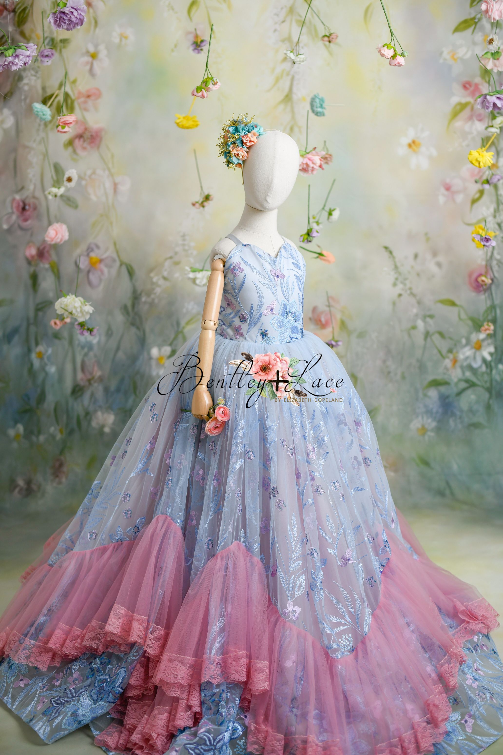 "Savannah Bloom gown’s layers of bridal soft tulle creating a voluminous and comfortable skirt for young girls."