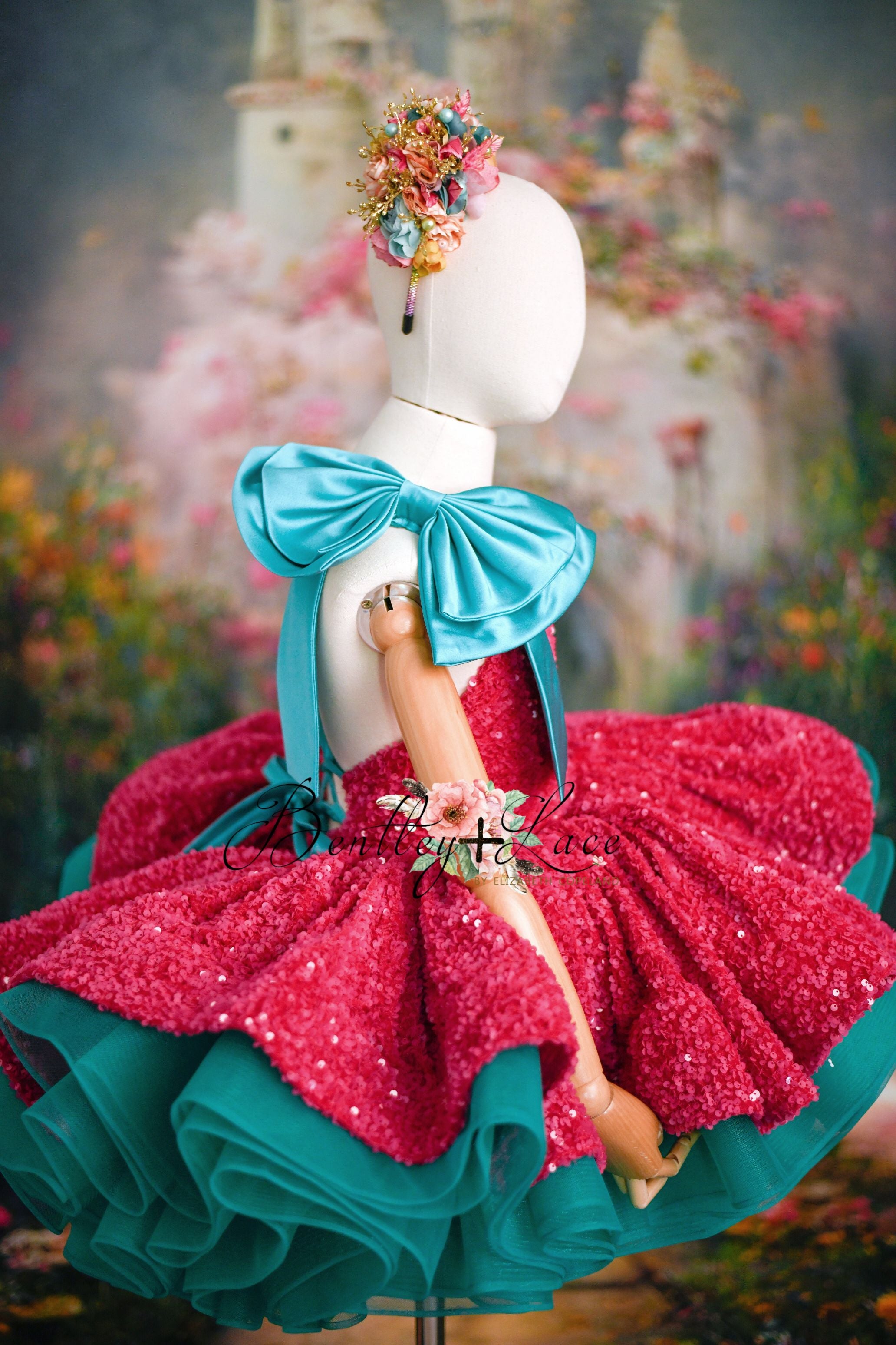 Pink sequin dress with turquoise tulle and detachable shoulder bows on hanger