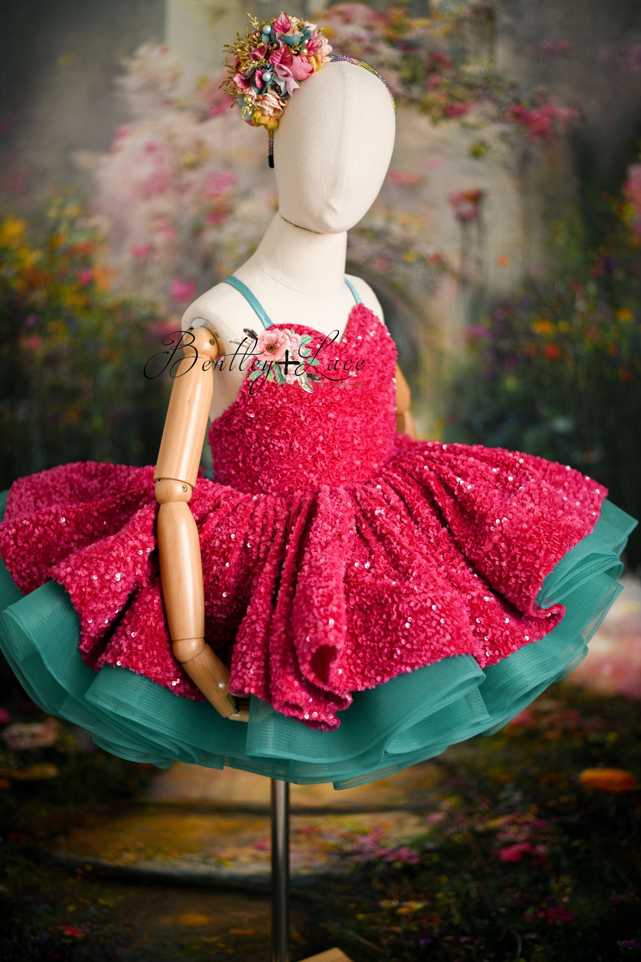 Front view of toddler wearing glamorous pink sequin dress with vibrant tulle