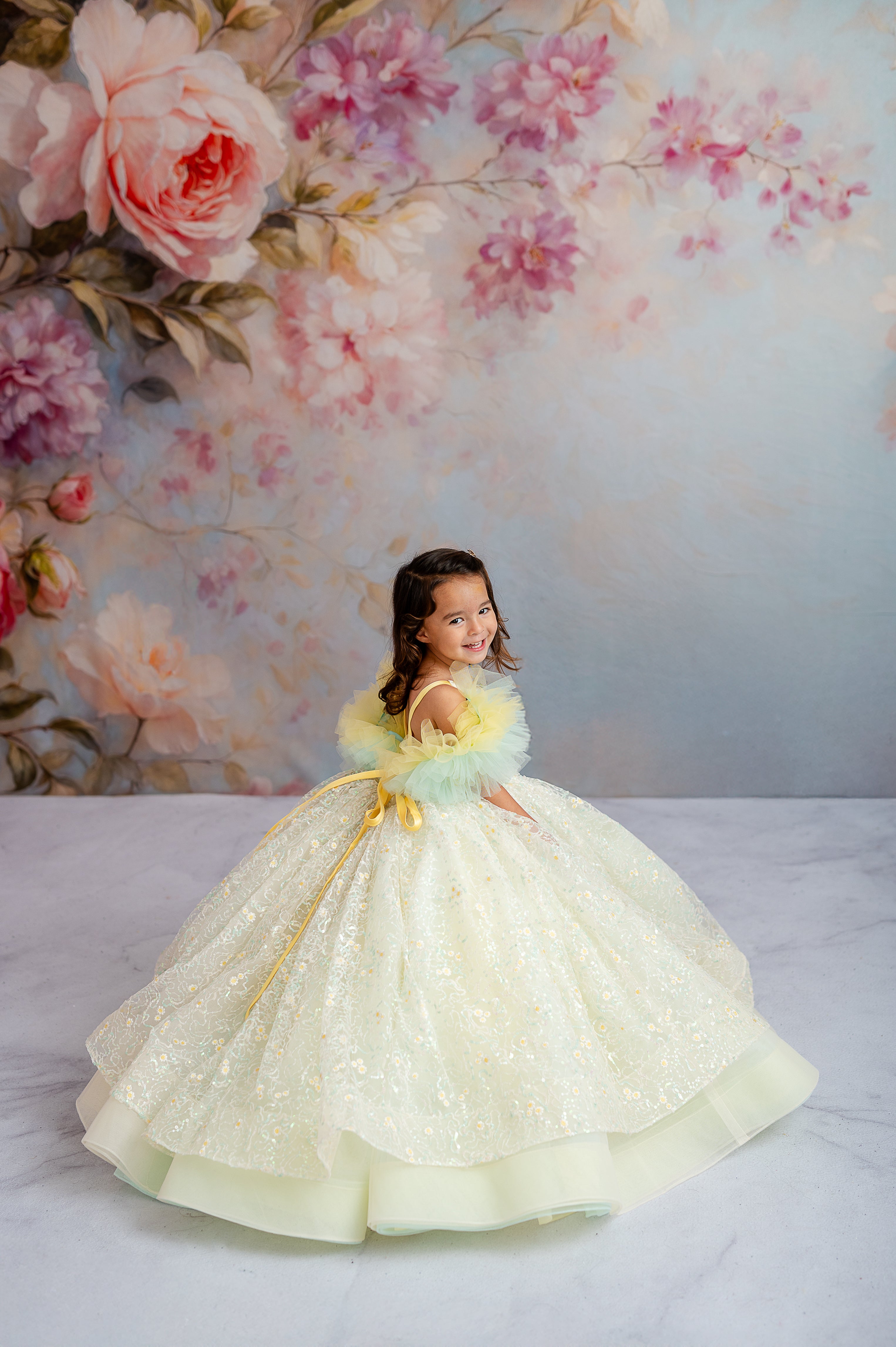A dreamy pastel wonder—the Harmony Gown is a stunning choice for creating fairytale-inspired portraits.