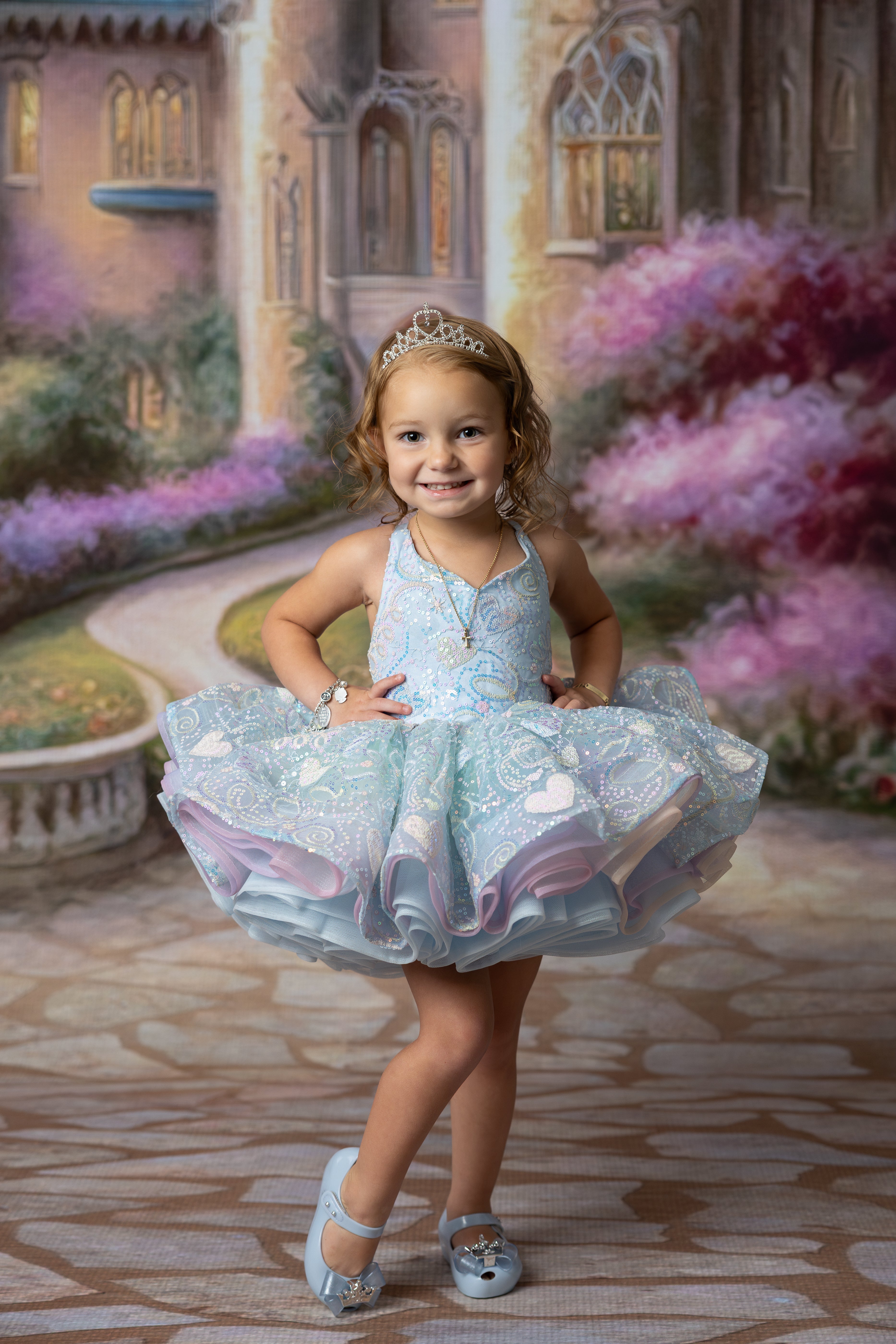 Colorful party dress for girls featuring soft rainbow tulle layers and shimmering top.