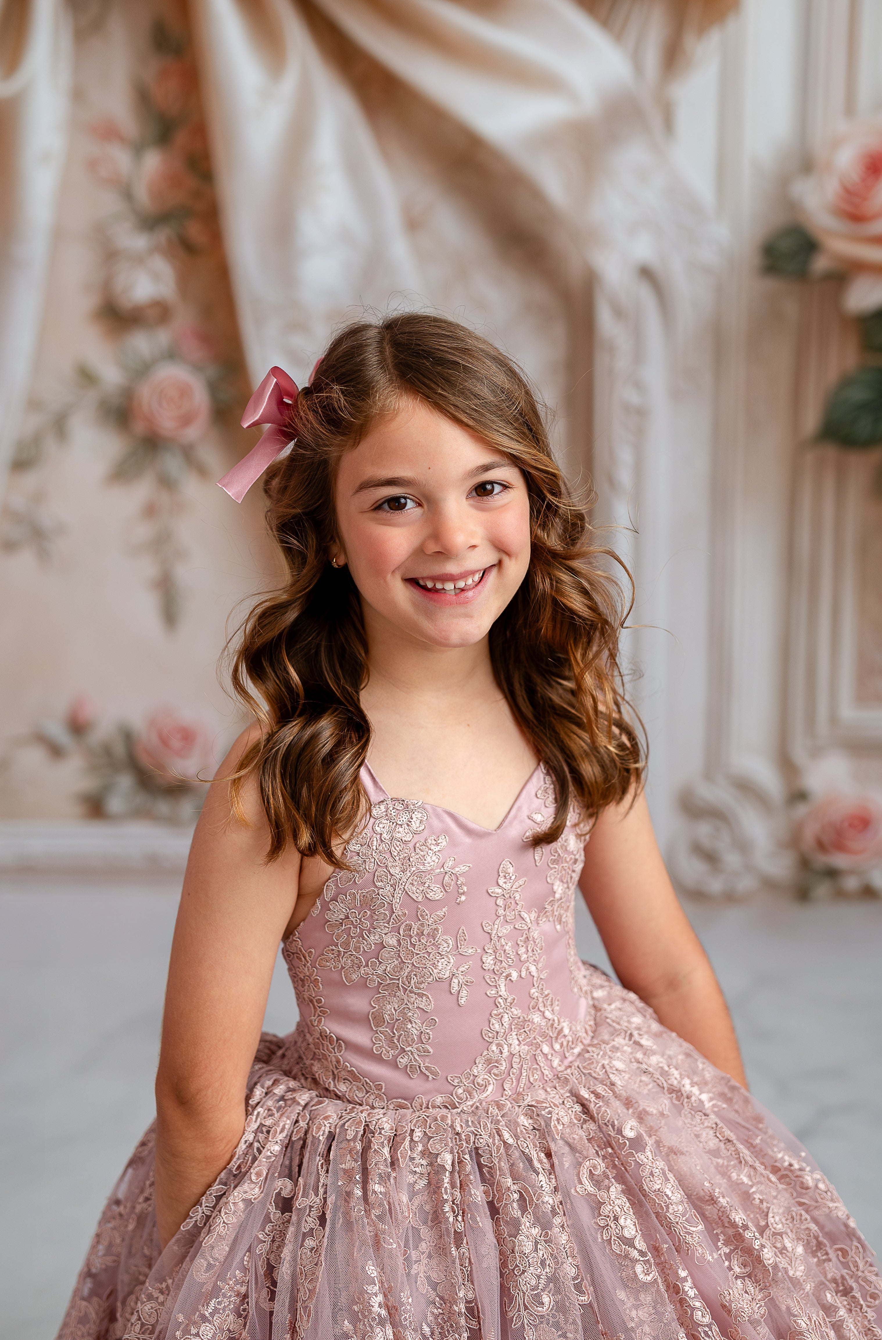 "Addison" Couture Rental Gown in Dusty Mauve, designed for 5- to 7-year-olds, showcasing a sleeveless bodice and flowing floor-length design.