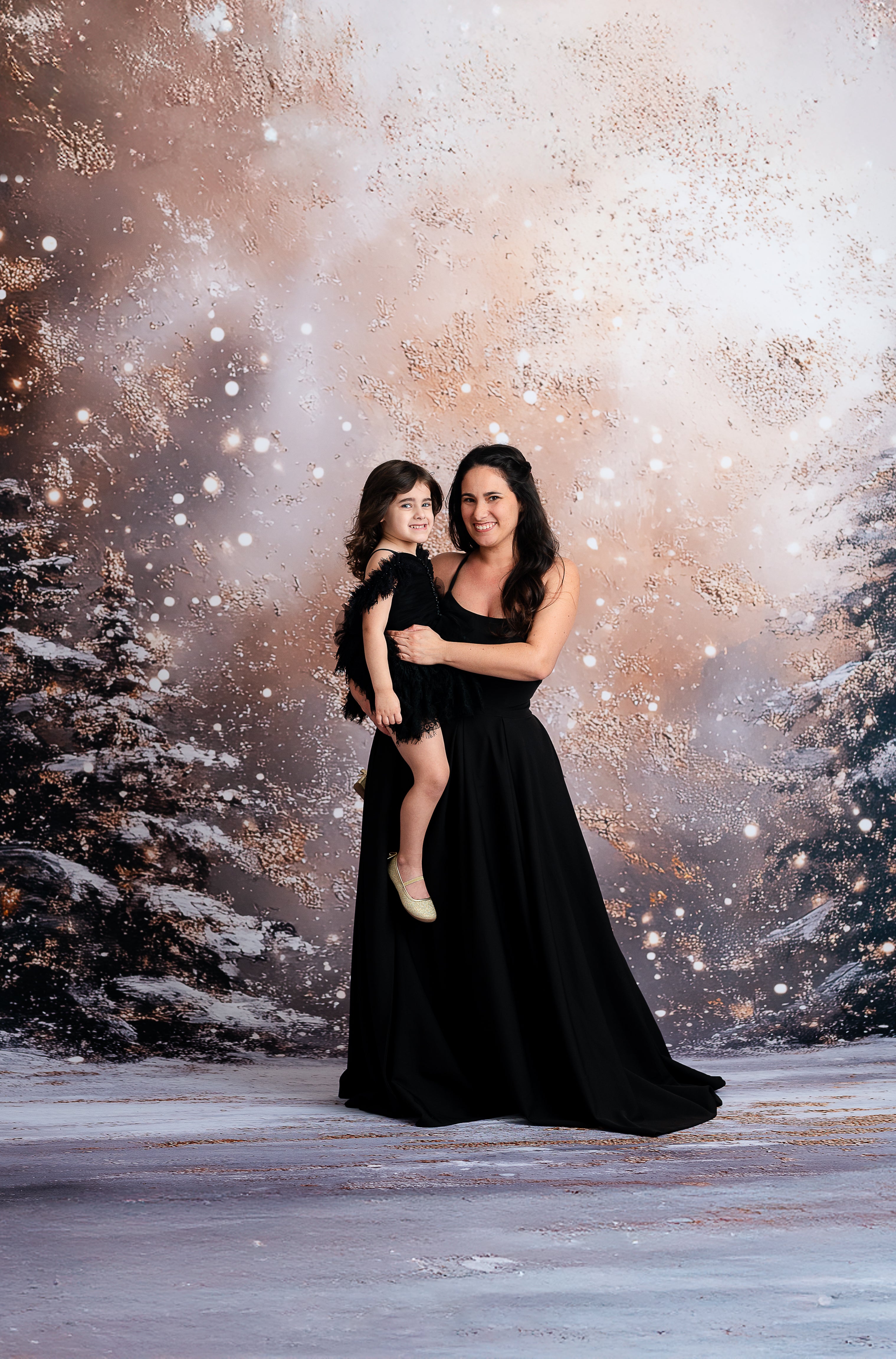 Chic mother wearing a black couture gown, perfect for formal occasions.