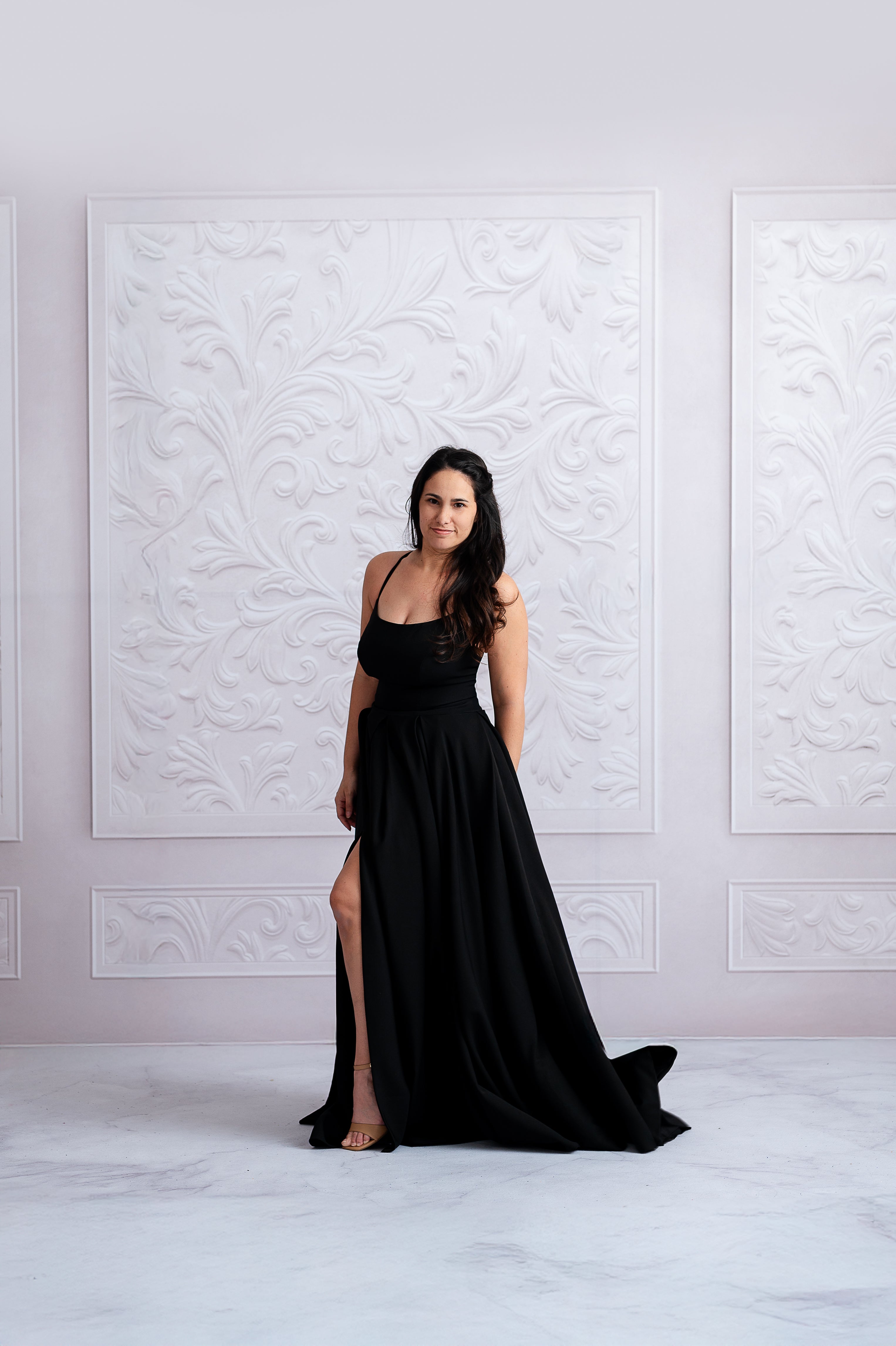 Chic mother wearing a black couture gown, perfect for formal occasions.