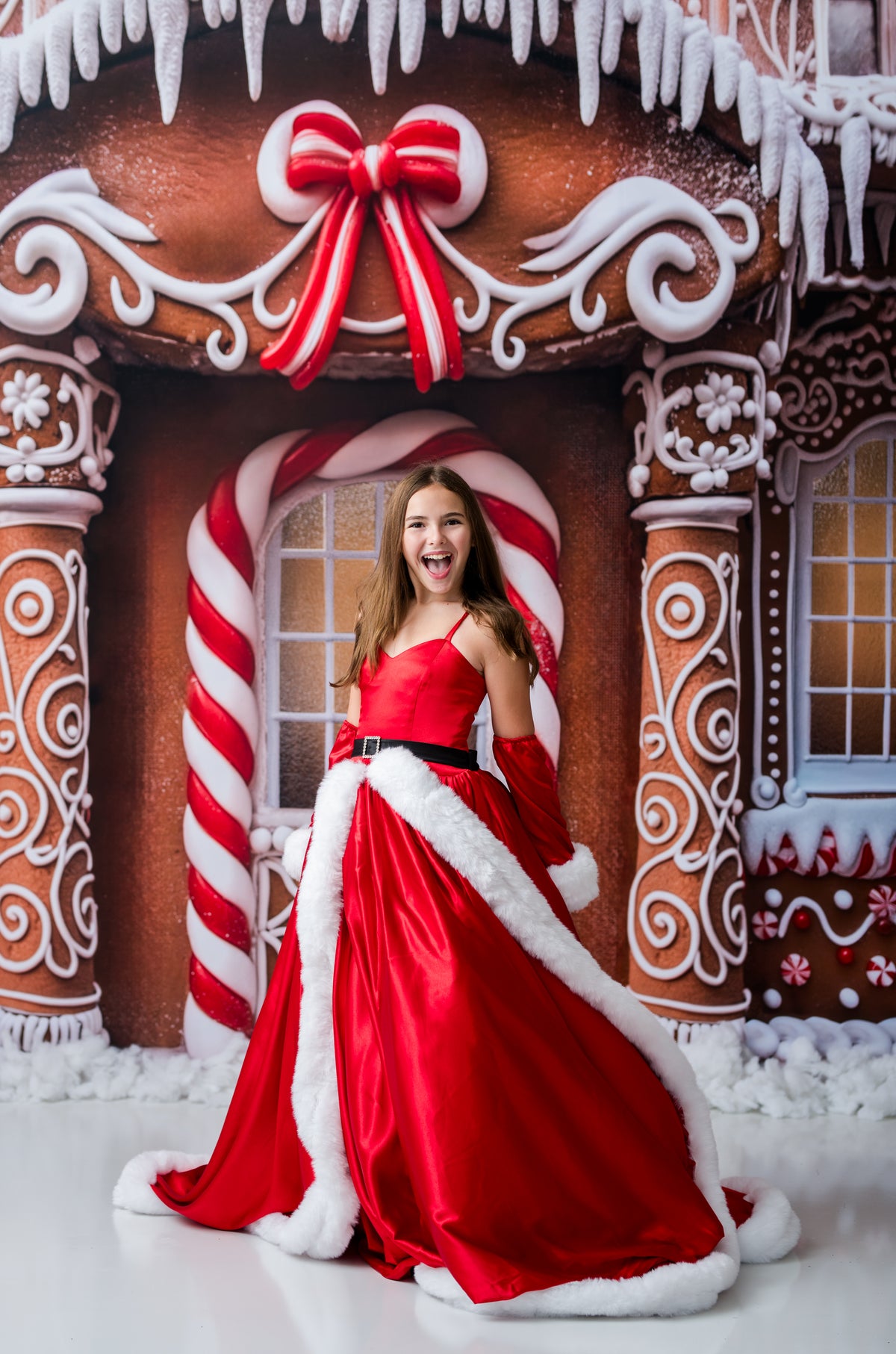 Dramatic Christmas gown rental with full red satin skirt white fur trim and adjustable fit