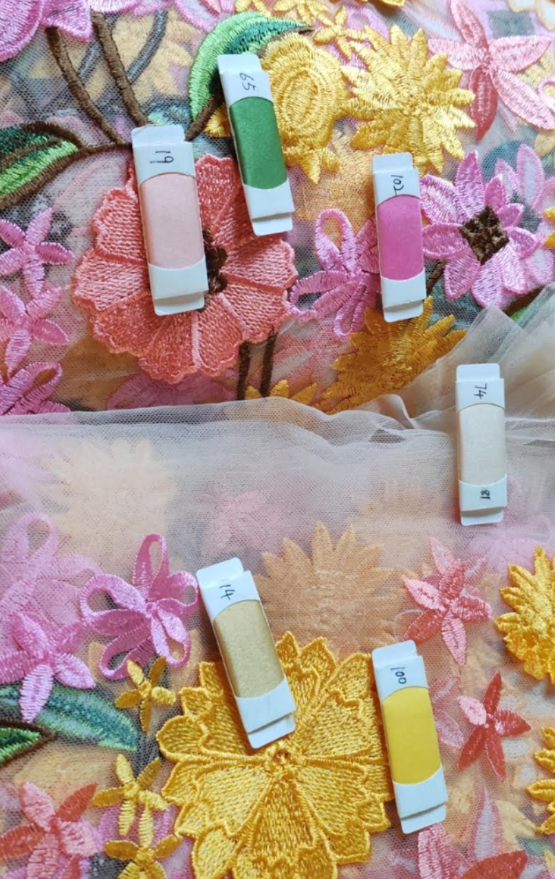 Three flower girl dresses with remnant colorful fabric, displayed with options for customization such as adding a bodice, shown with three different color options.