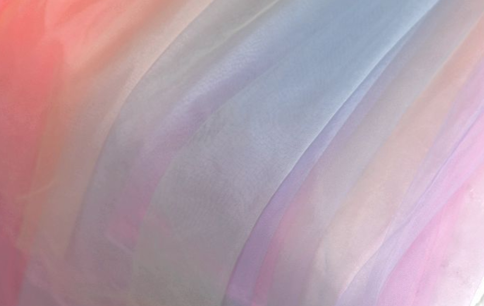 Chasing Rainbows dress in soft pastel hues with detachable tulle sleeves, designed for elegance.