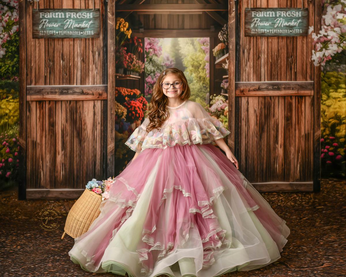 "Girl wearing a delicate floral gown, perfect for a springtime celebration."