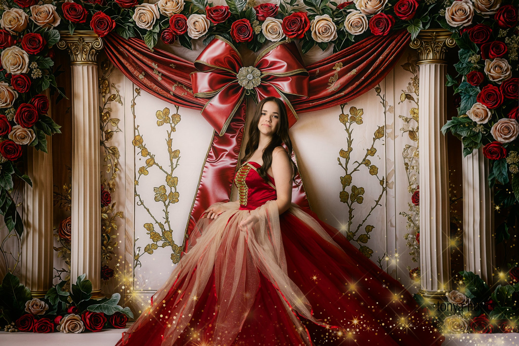 Twirl shot of red gown showcasing movement of cascading tulle