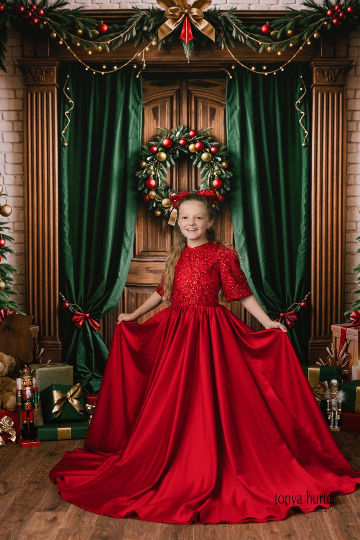 Young girl twirling in the Scarlet Sparkle petal-length gown outdoors