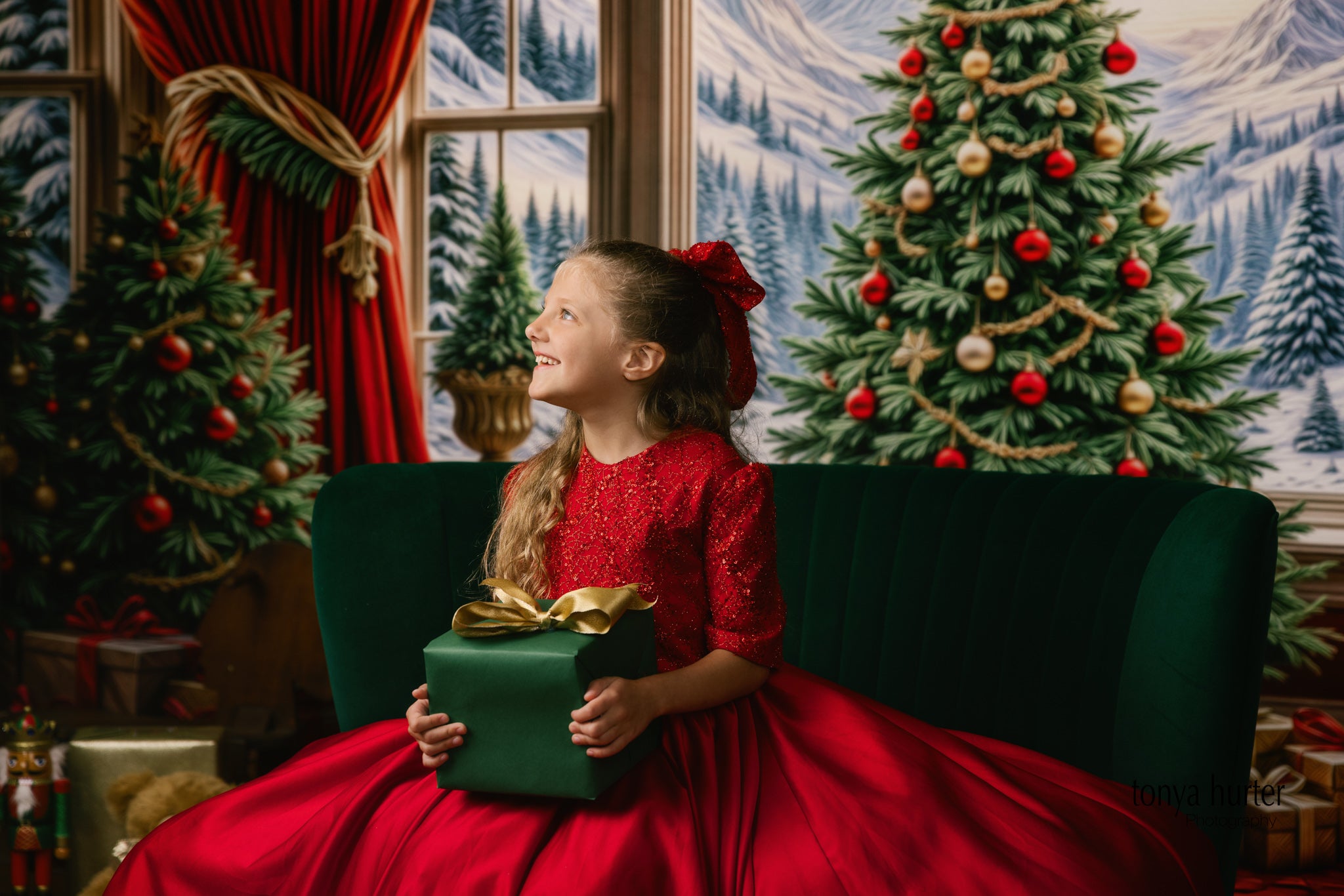 Enchanting portrait of a girl in a sparkling red couture dress