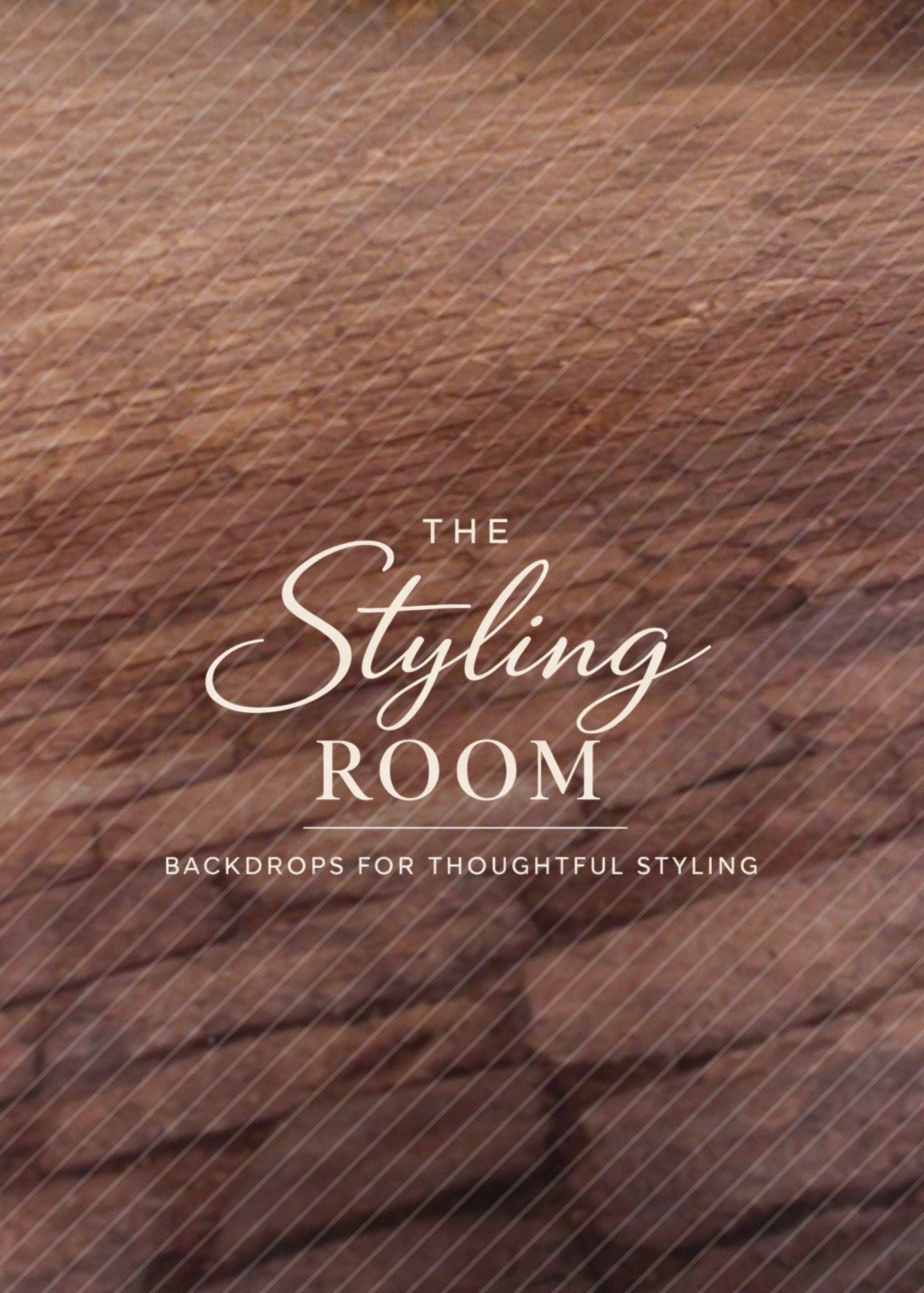 Wooden backdrop with 'The Styling Room' text