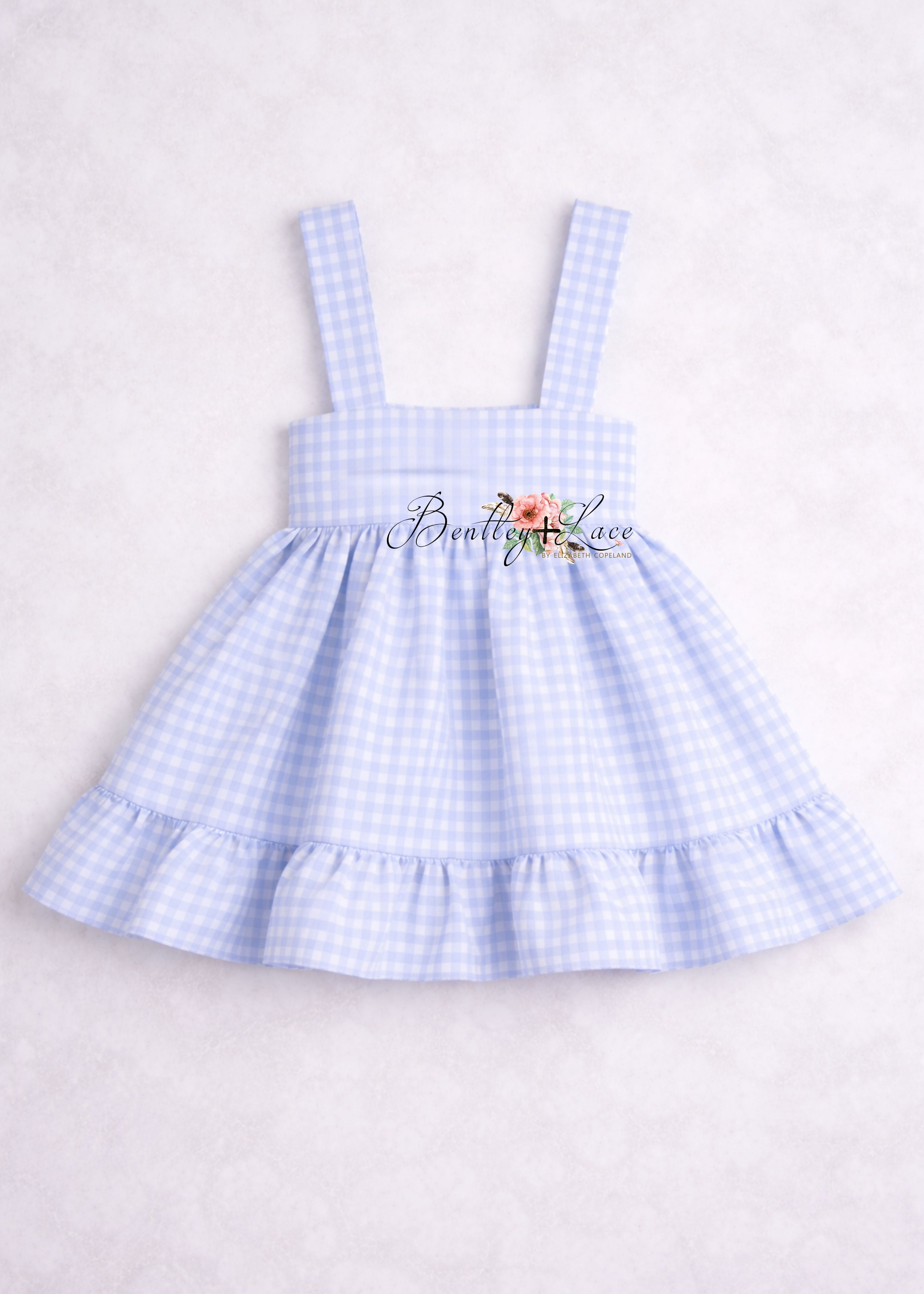 Blue checkered dress on a light gray background