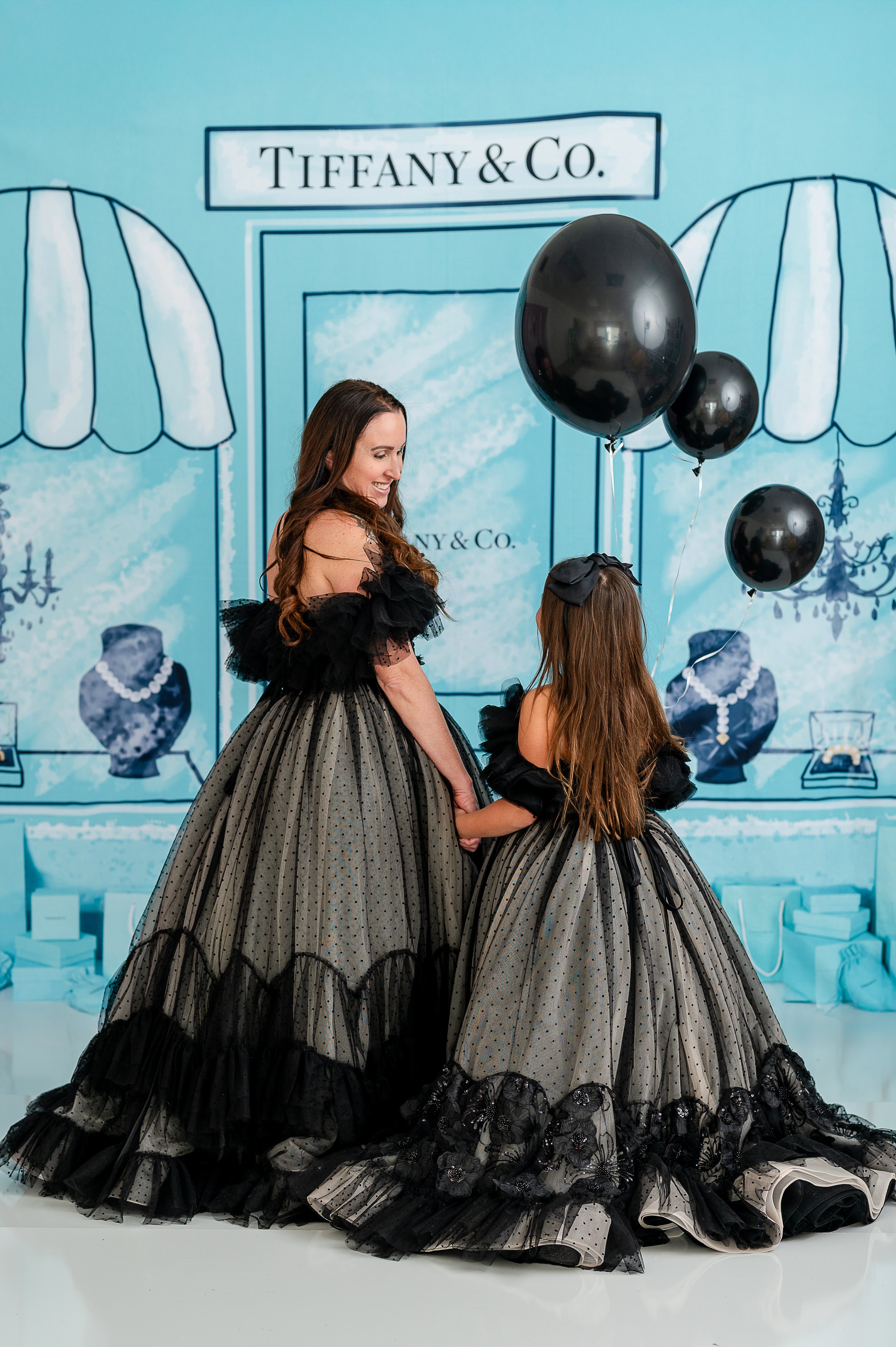 A poised model showcases the versatility of the Swish Dot gown for editorial photography.