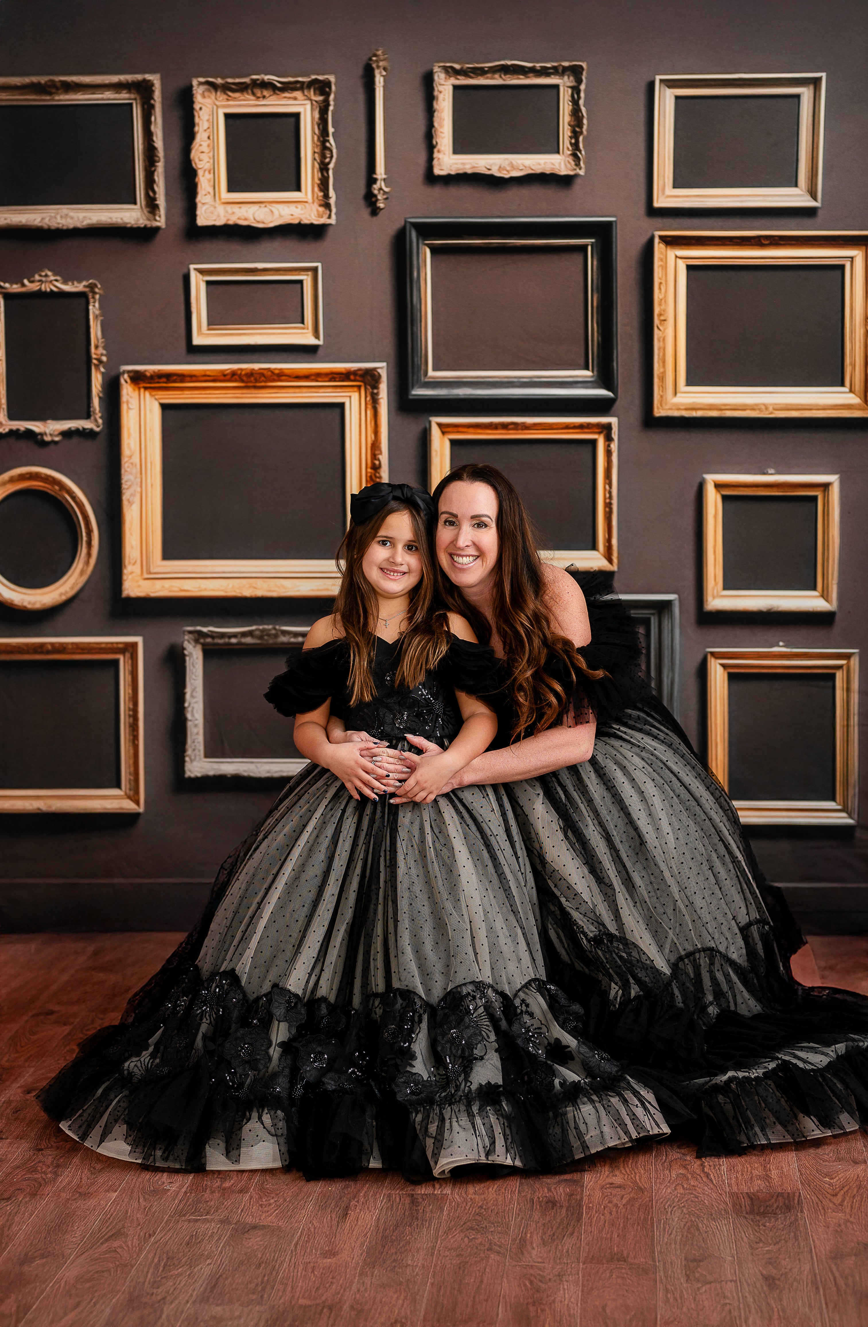 The voluminous ruffled hemline adds movement and depth to the elegant tulle gown.