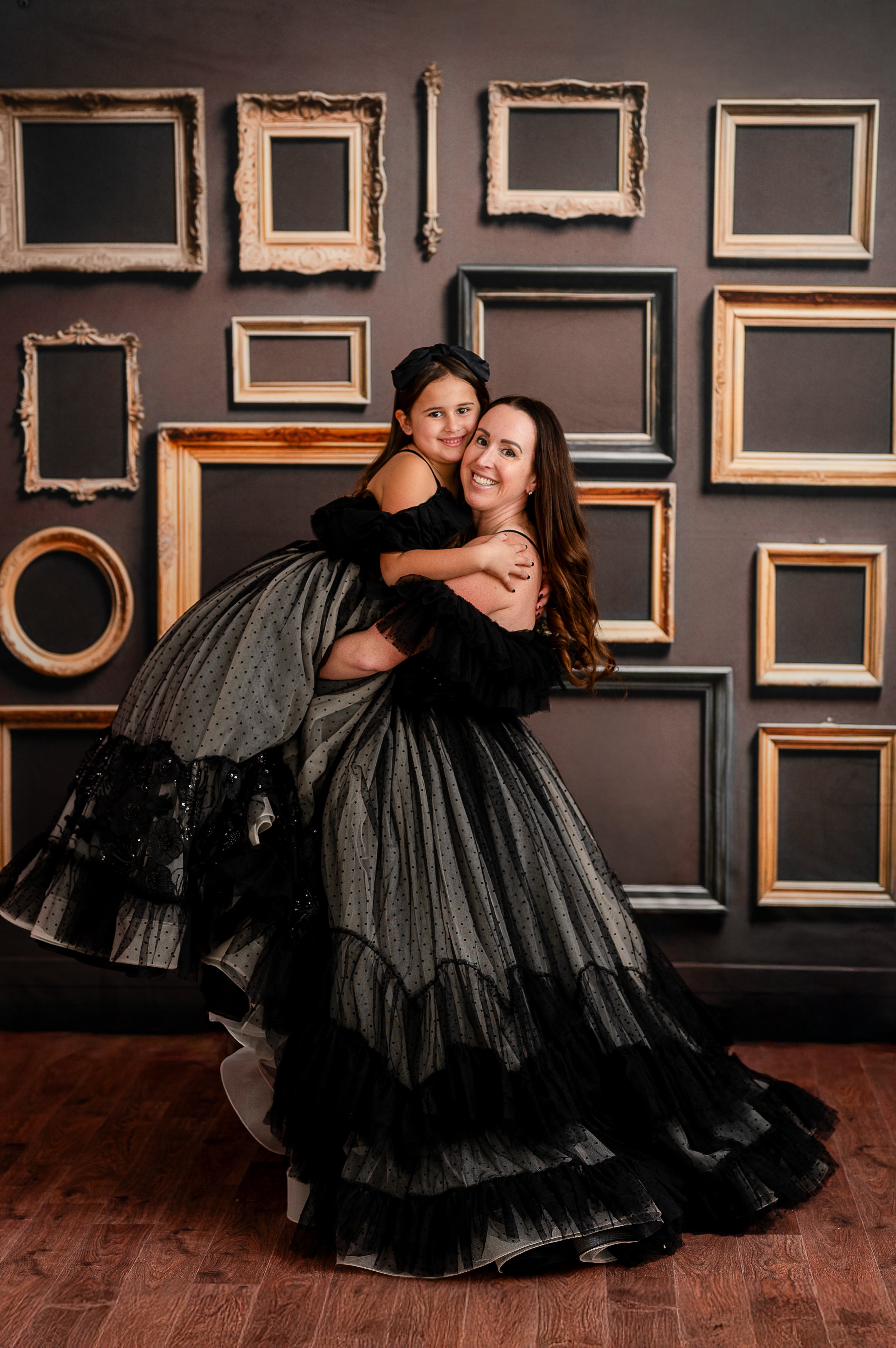 The off-the-shoulder tulle ruffles add a whimsical and romantic touch to this statement gown.
