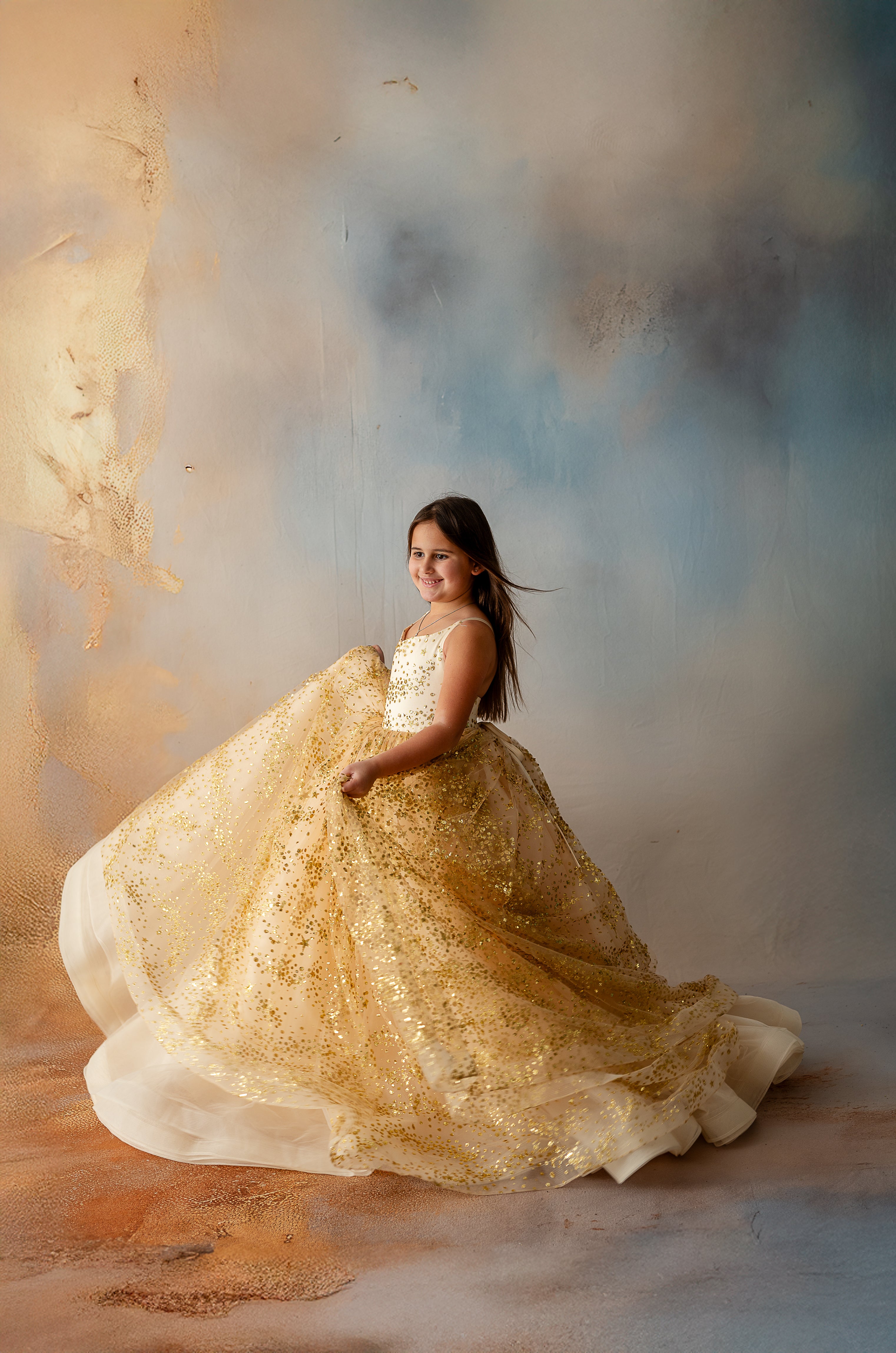 Close-up of glittering gold star fabric on girl's dress
