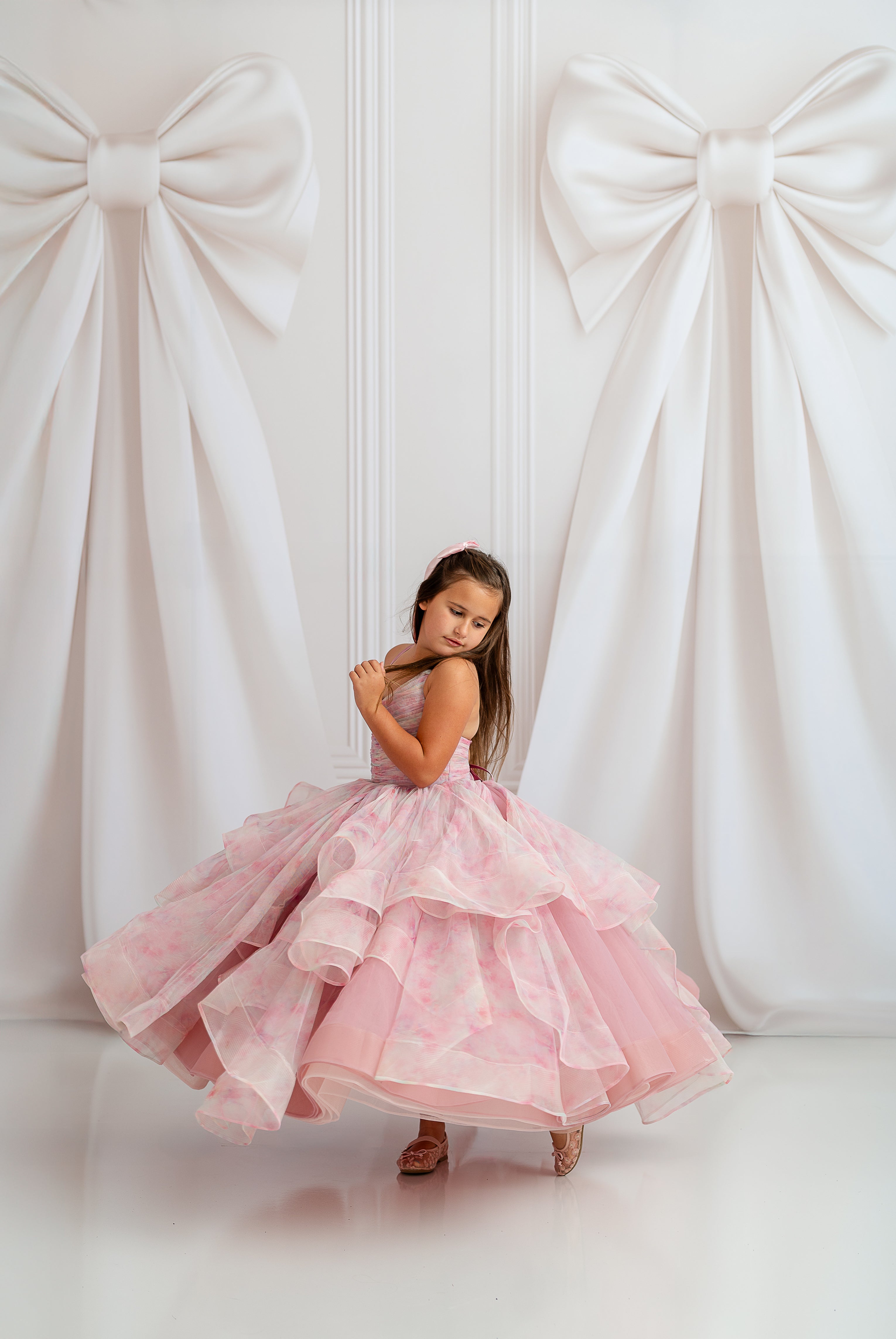 "Back view of Pastel Clouds Gown showing light, airy layers and flowy movement"