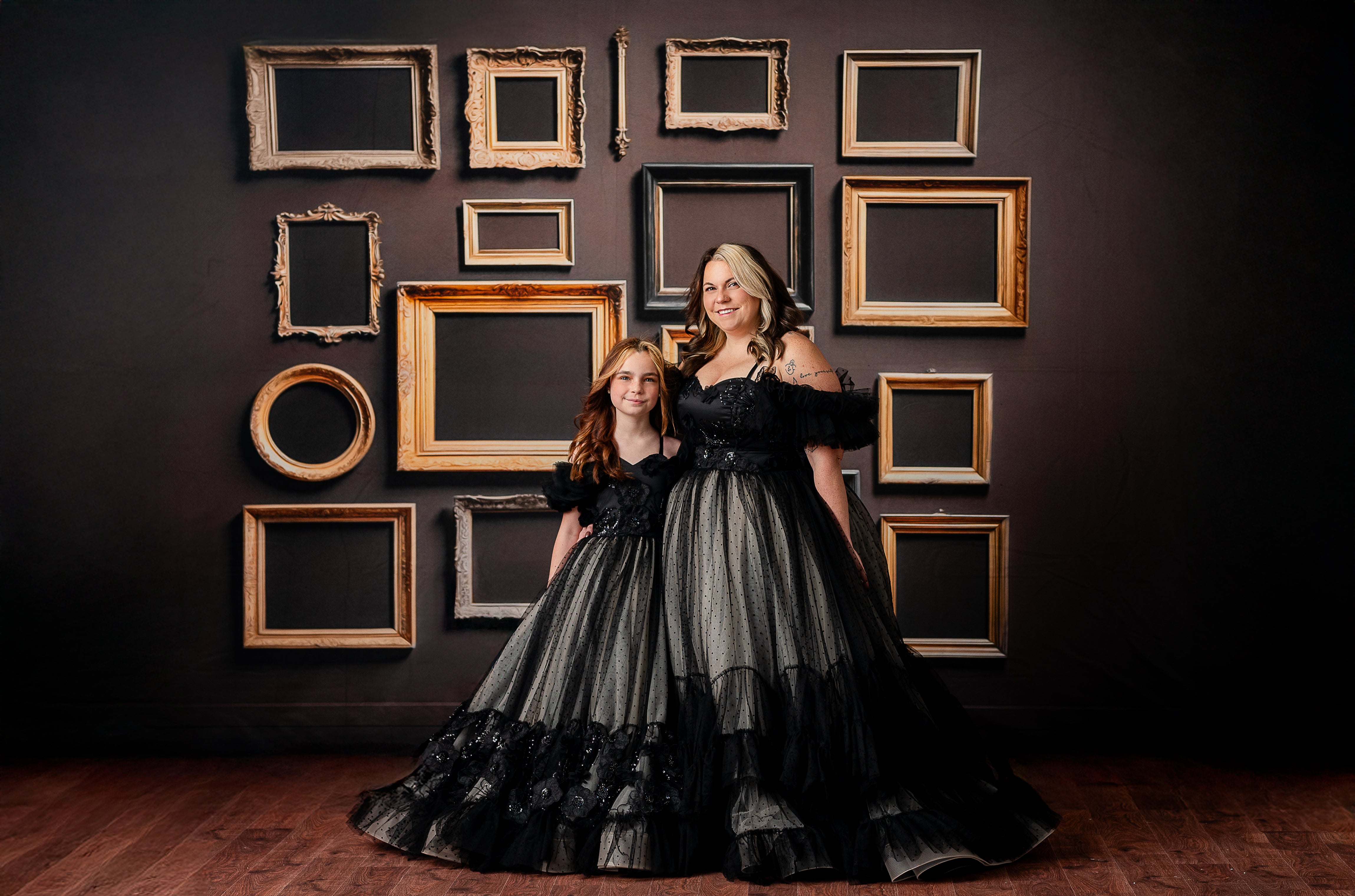 A sophisticated black and nude polka-dot gown styled for a moody, editorial-inspired photoshoot.
