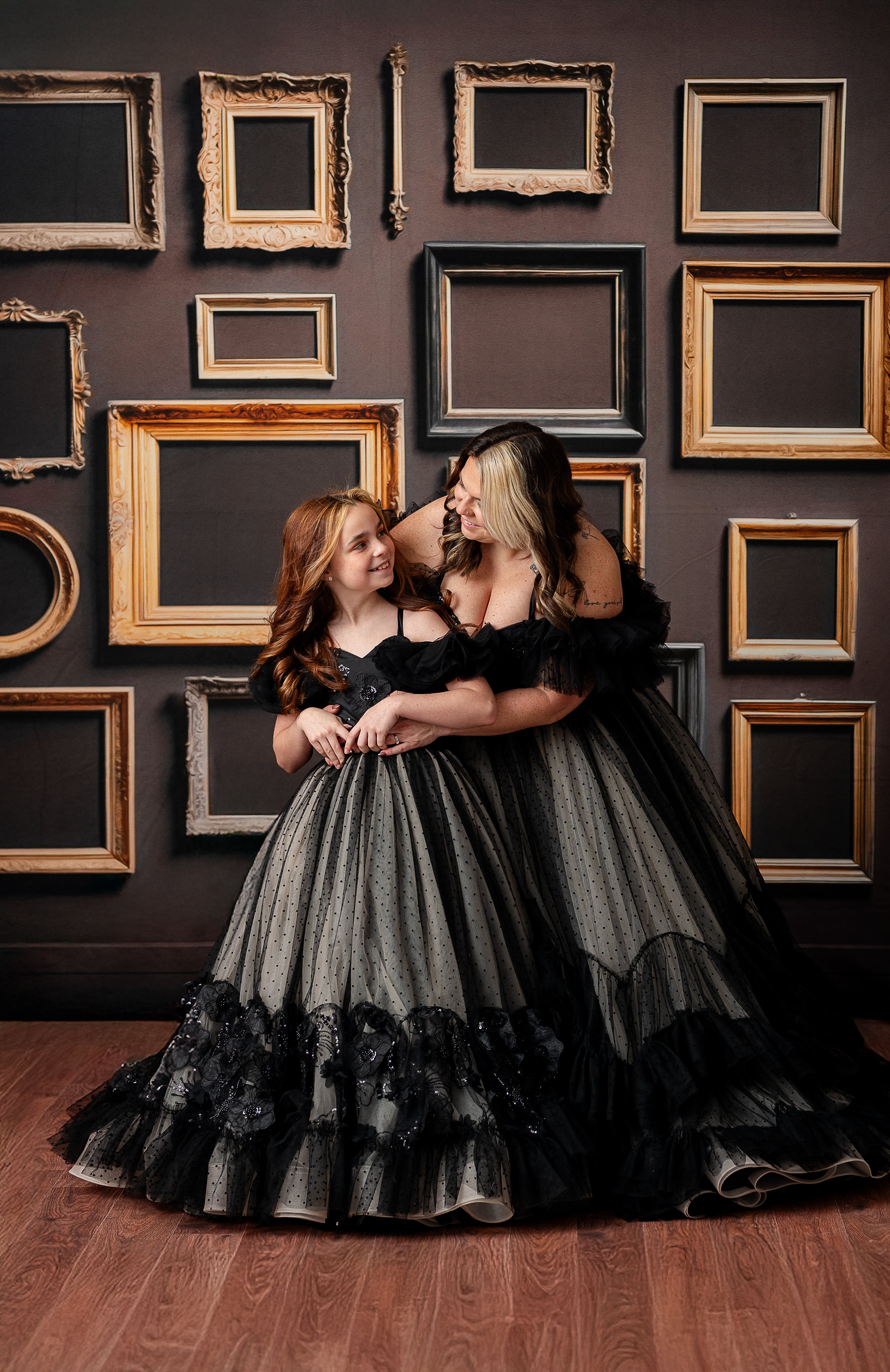 The Swish Dot couture gown flows elegantly as the wearer lifts the layered tulle skirt.