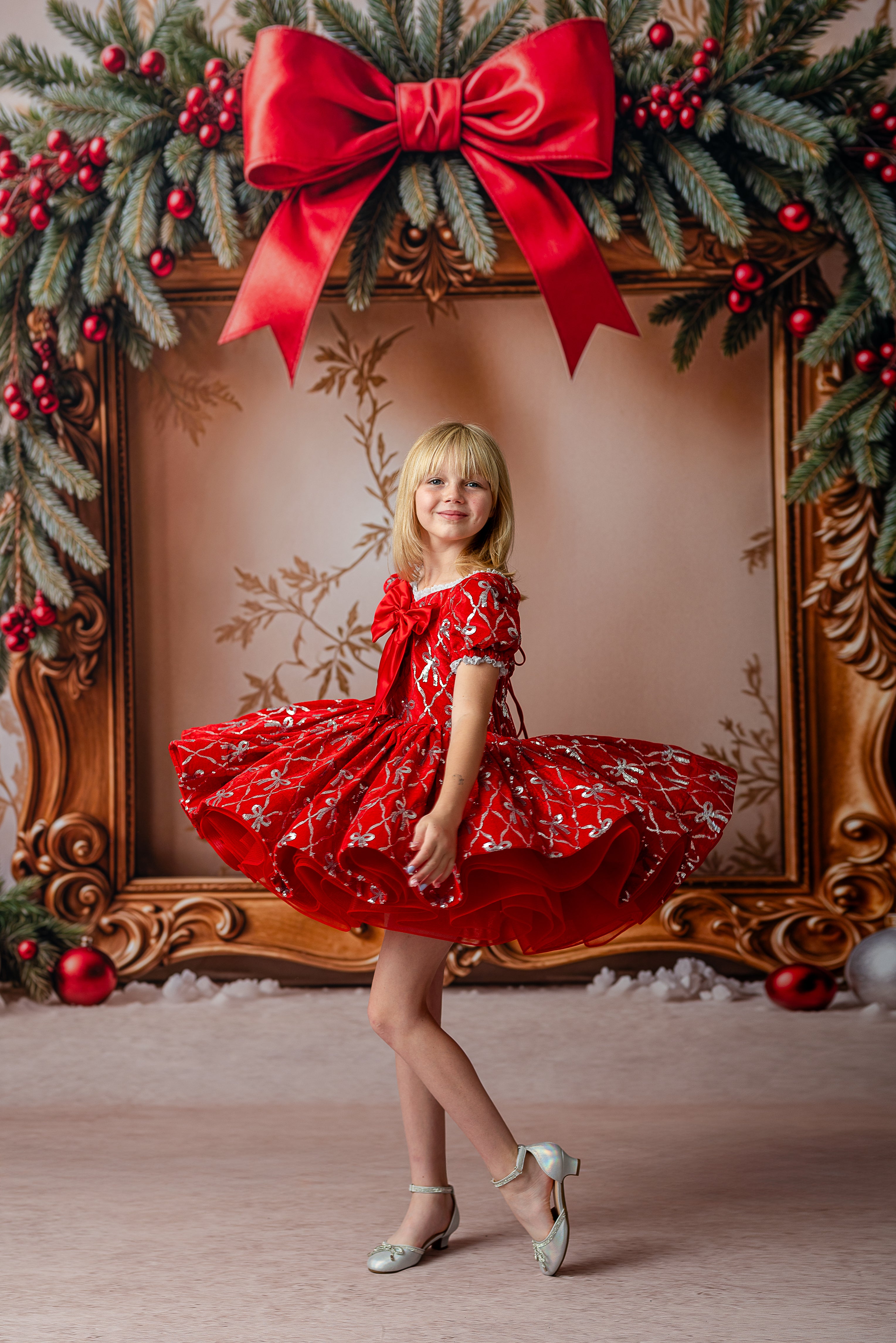 Festive red holiday dress with puffed skirt and embroidered silver bows