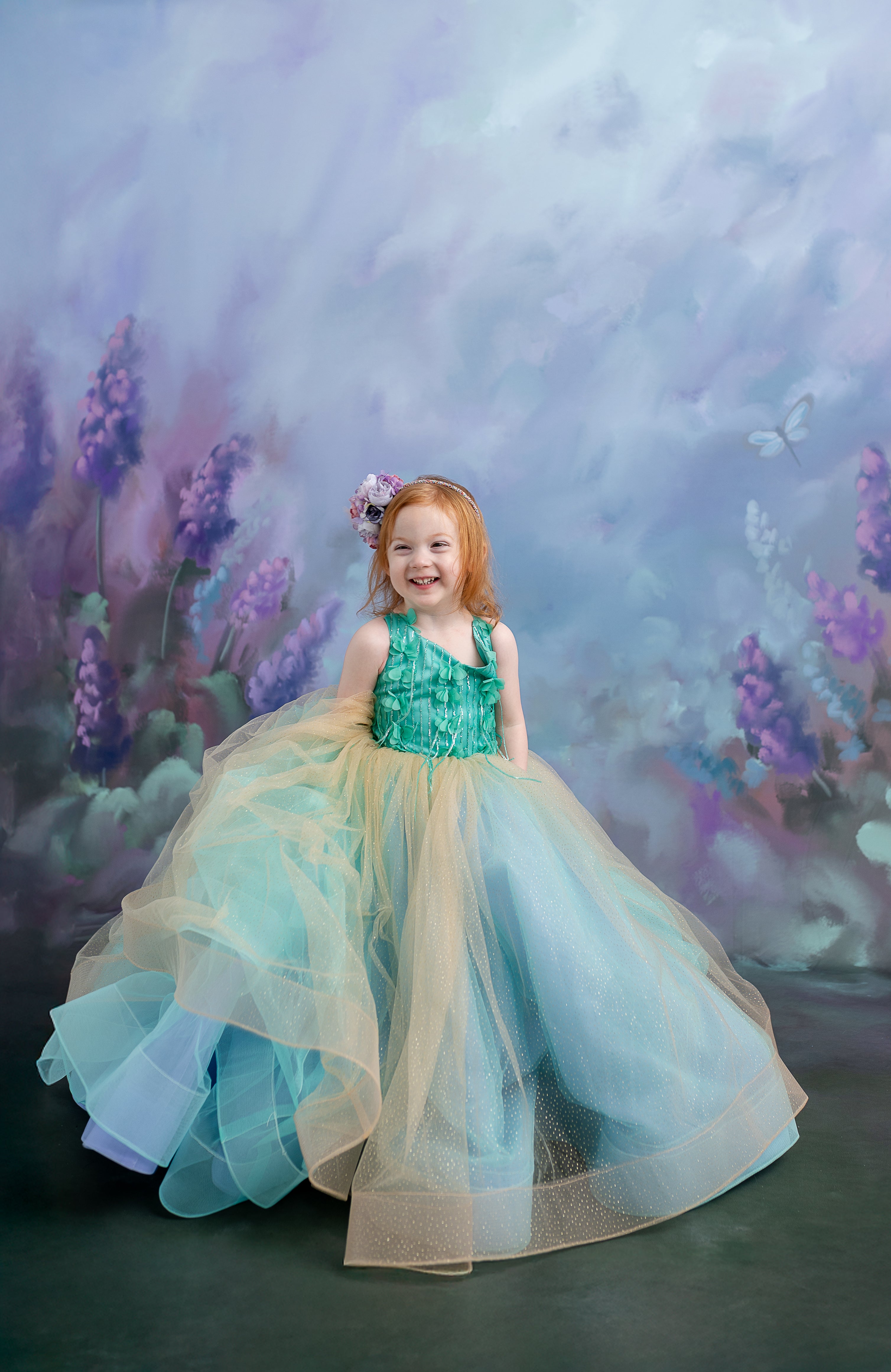 The Evelyn gown styled with a matching floral hairpiece, completing the enchanting princess look.