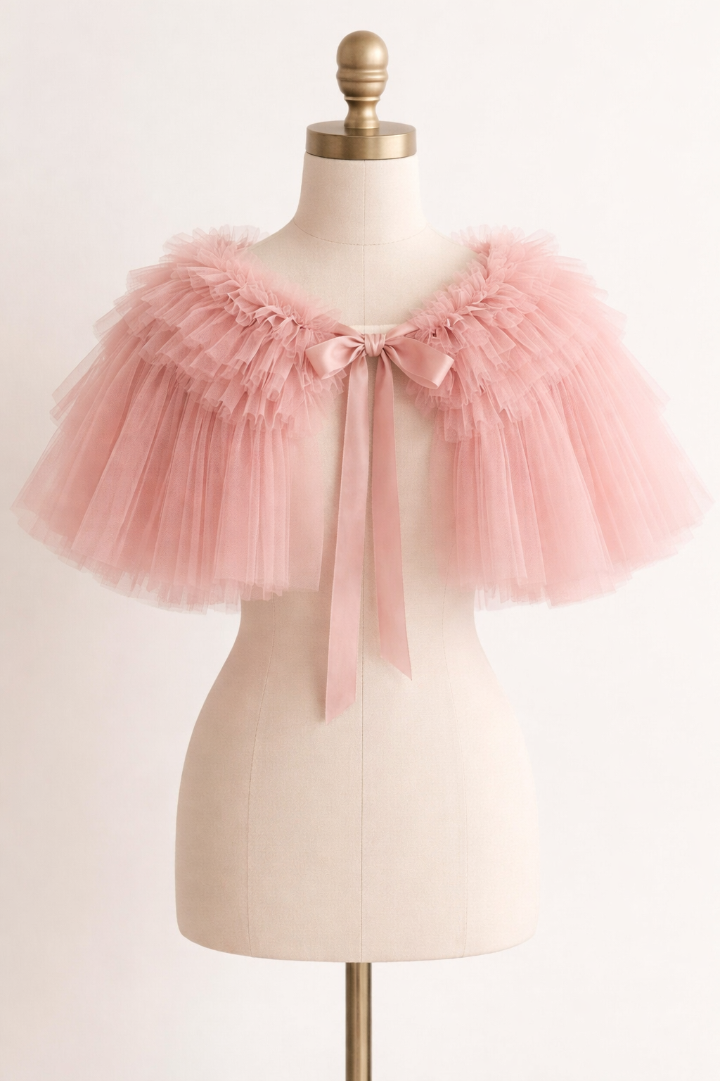 Pink tulle skirt on a mannequin against a light background