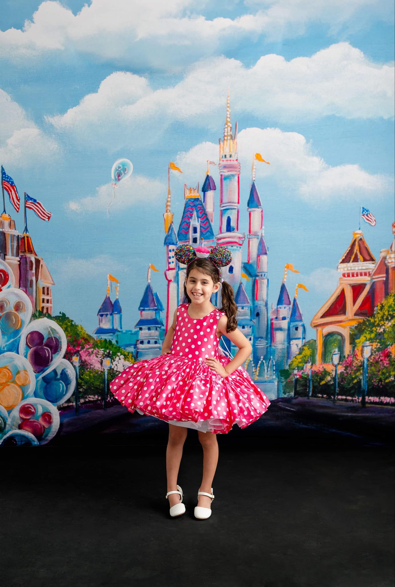"Adorable pink and white polka dot dress inspired by Minnie Mouse, complete with a flared skirt and matching bow headband."