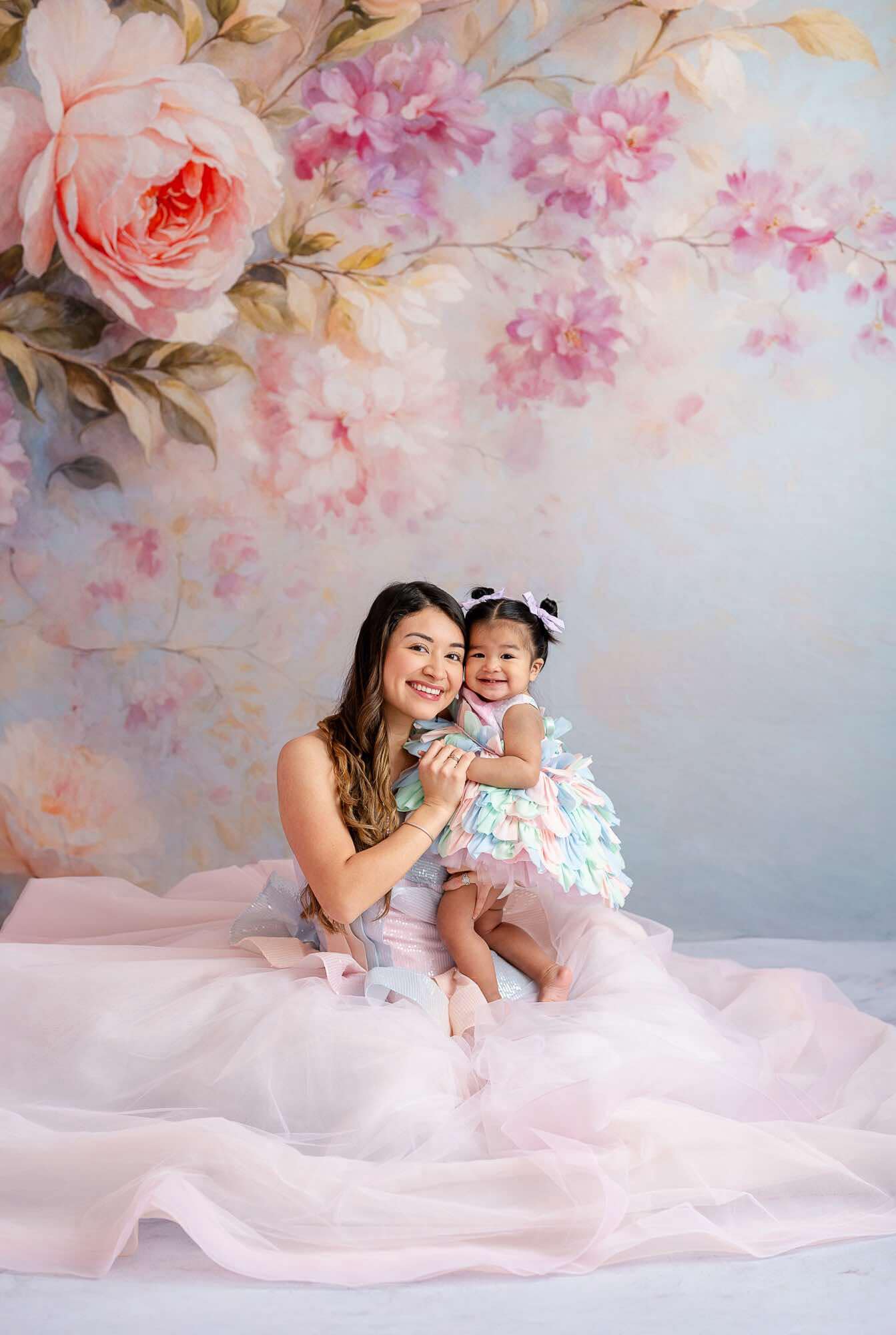 "Soft and dreamy portrait of mommy and me in a pastel-themed couture dress."