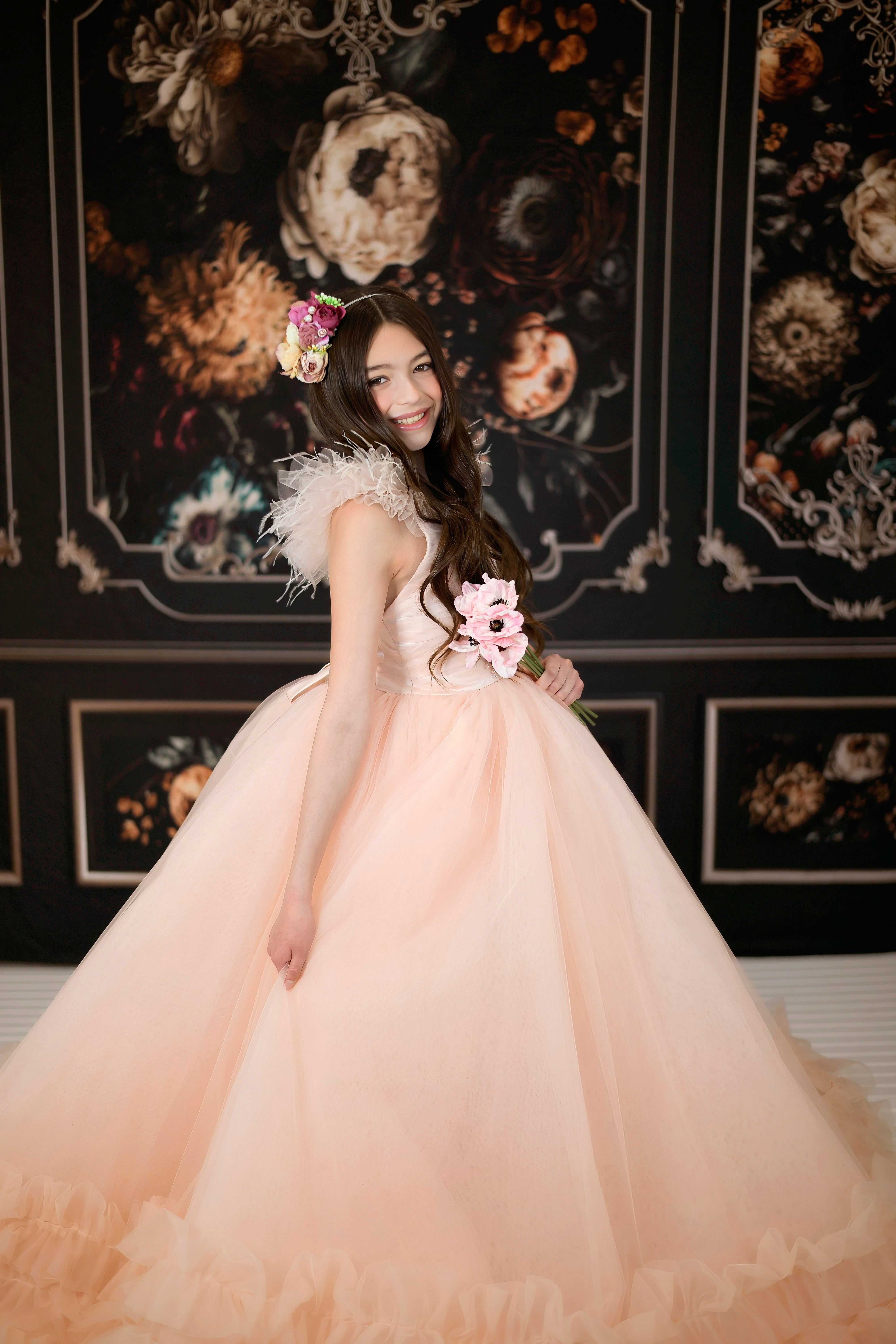 "Model in Monreau gown twirling to show layered ruffle skirt and flowing tulle"