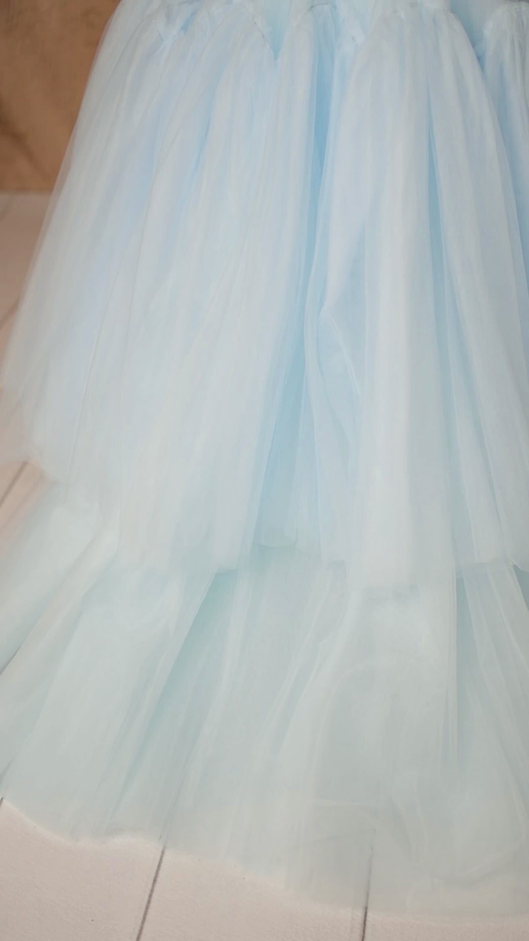 Detail of the tulle fabric on the Heavenly gown, emphasizing its soft texture and flowing layers.