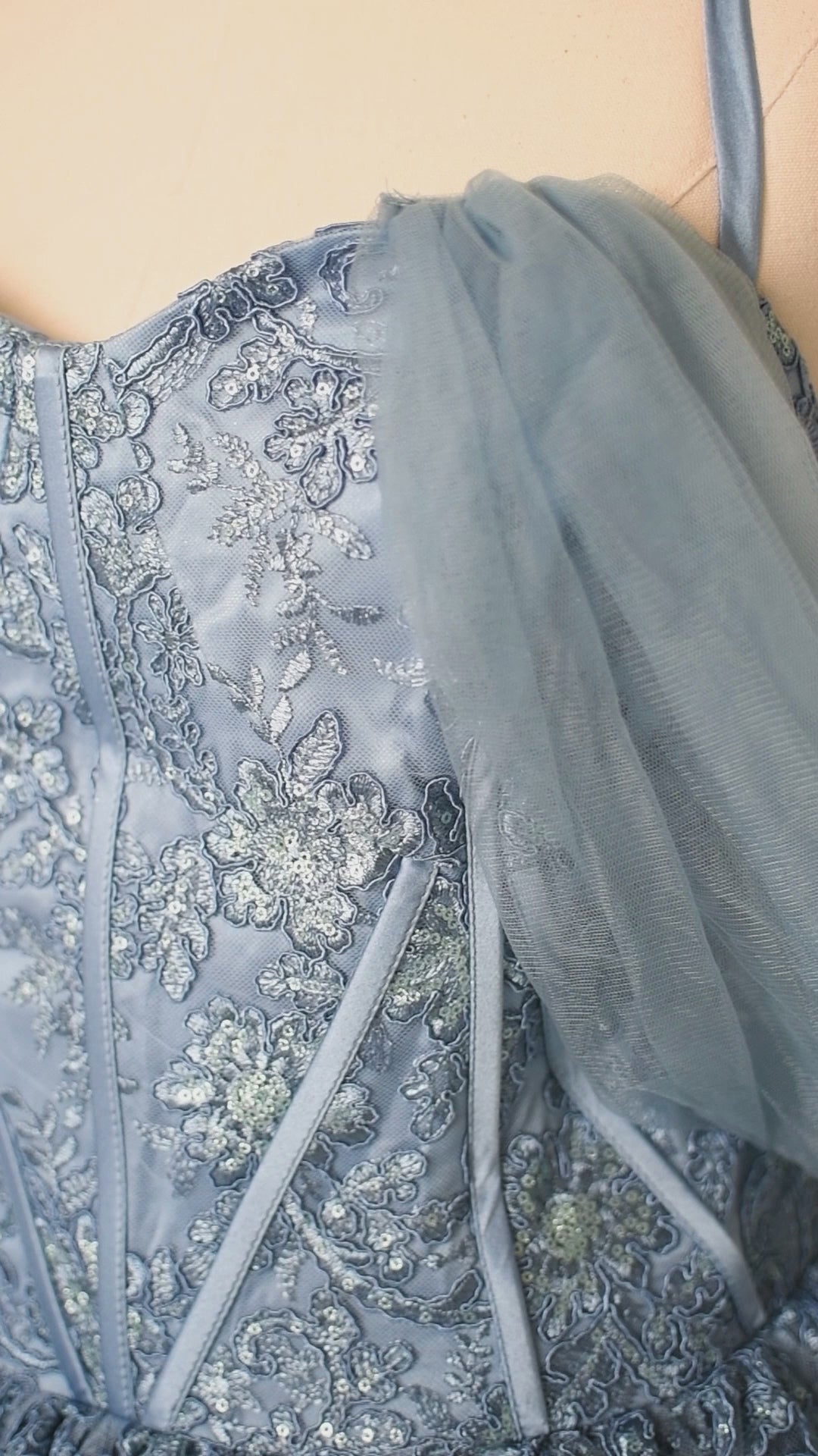 Close-up of embroidered bodice with shimmering sequin details