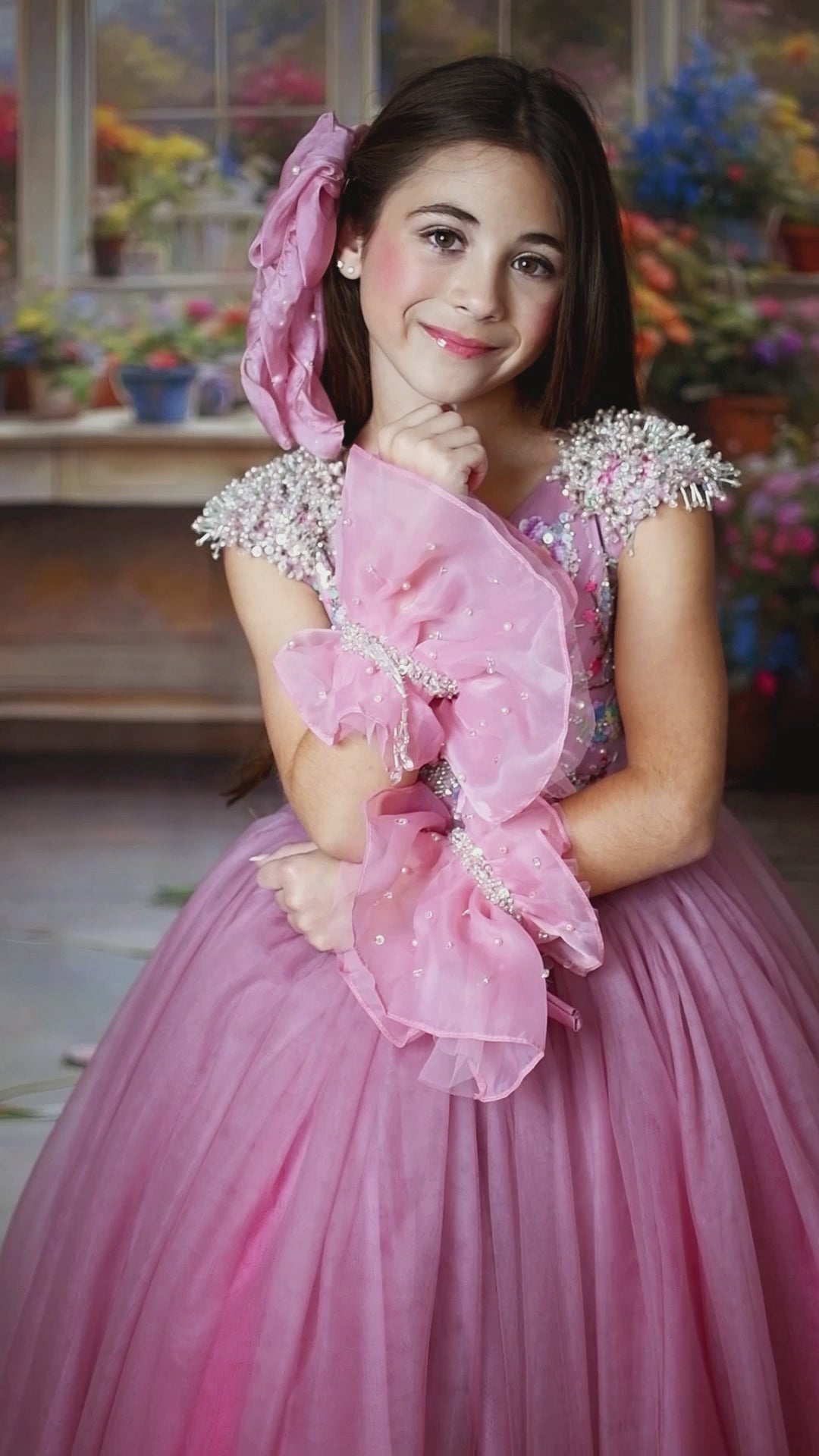 "Close-up of a beautifully crafted pink Asha gown with shimmering accents, perfect for photography sessions."