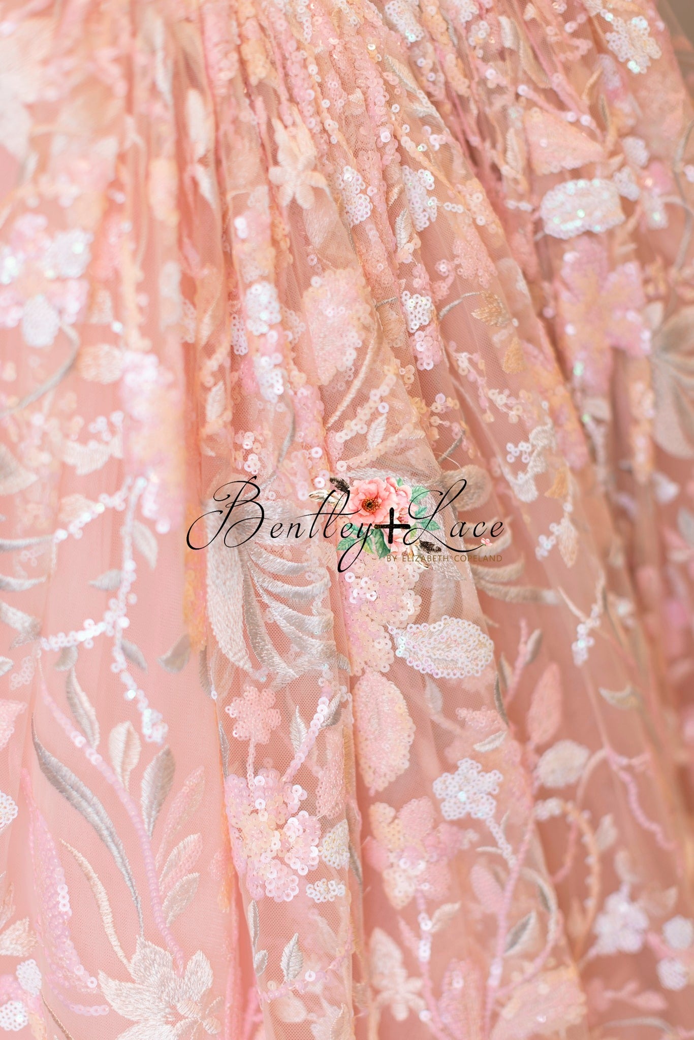 Peachy pink Marley dress shown with matching floral headband.