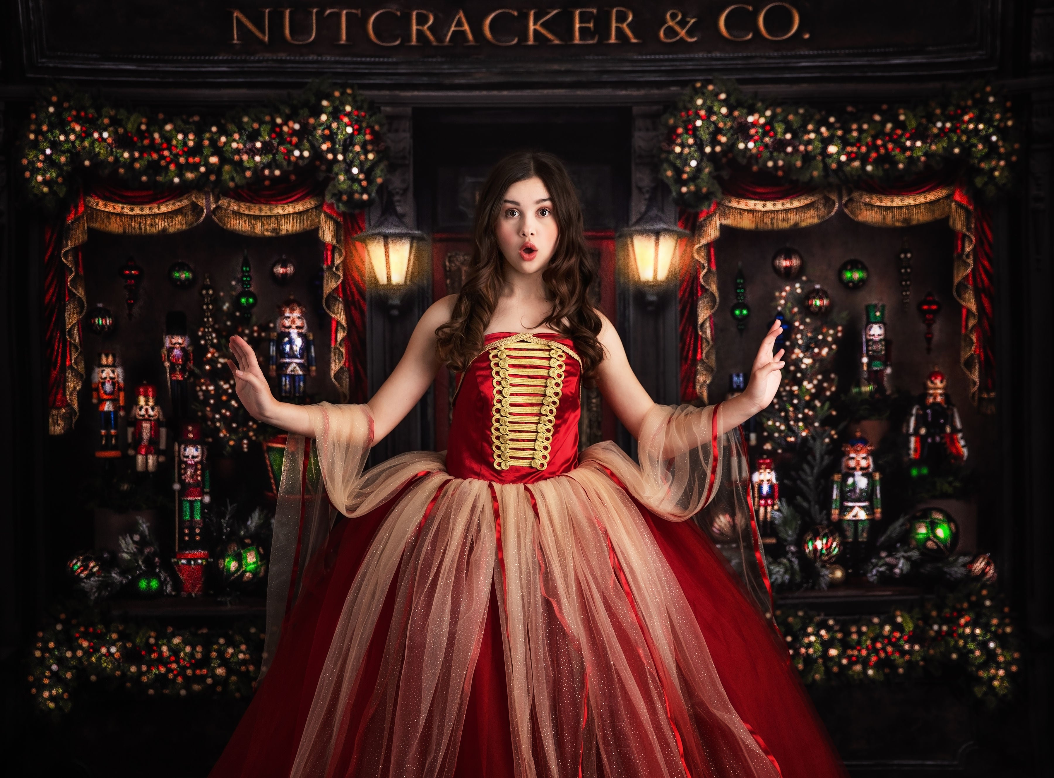 Whimsical photo of girl dancing in ruby red and gold tulle dress