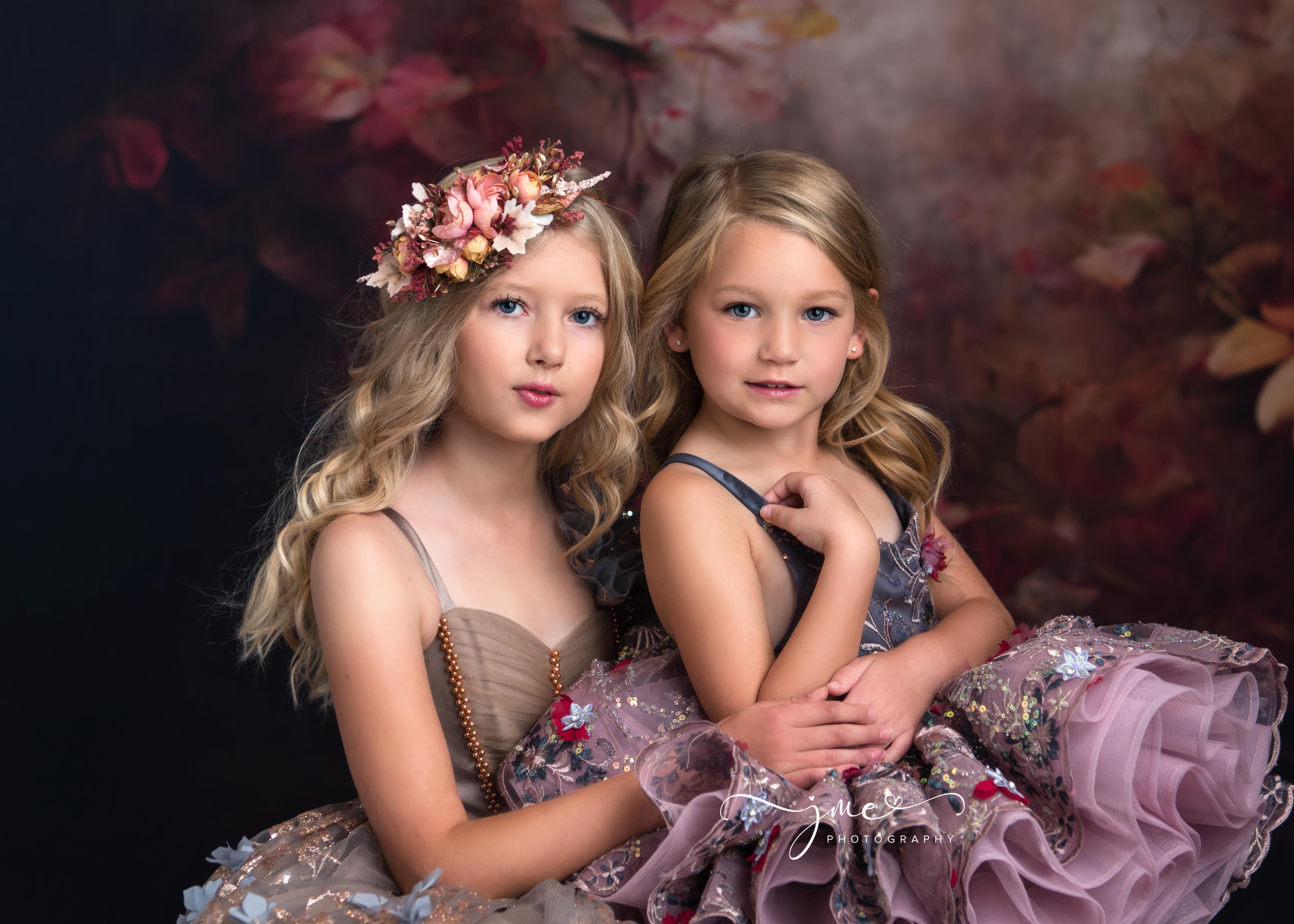 Sisters wearing beautiful couture gowns