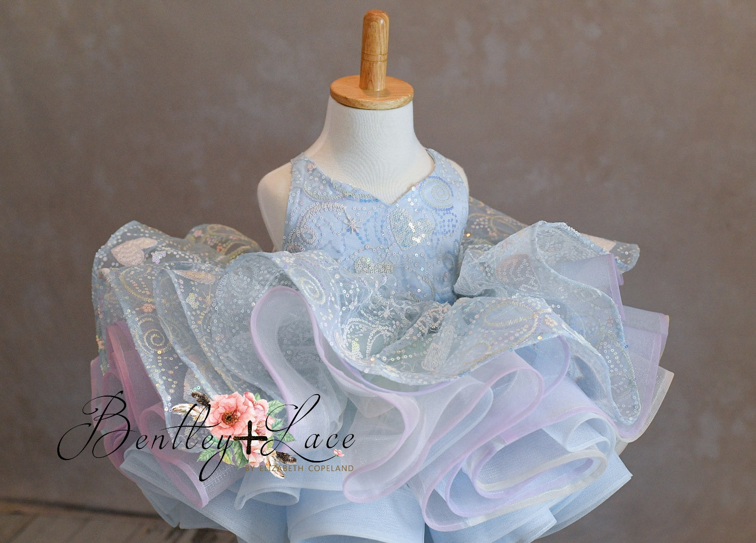 Soft and lined children’s gown with sequins and layers of bridal-quality tulle.