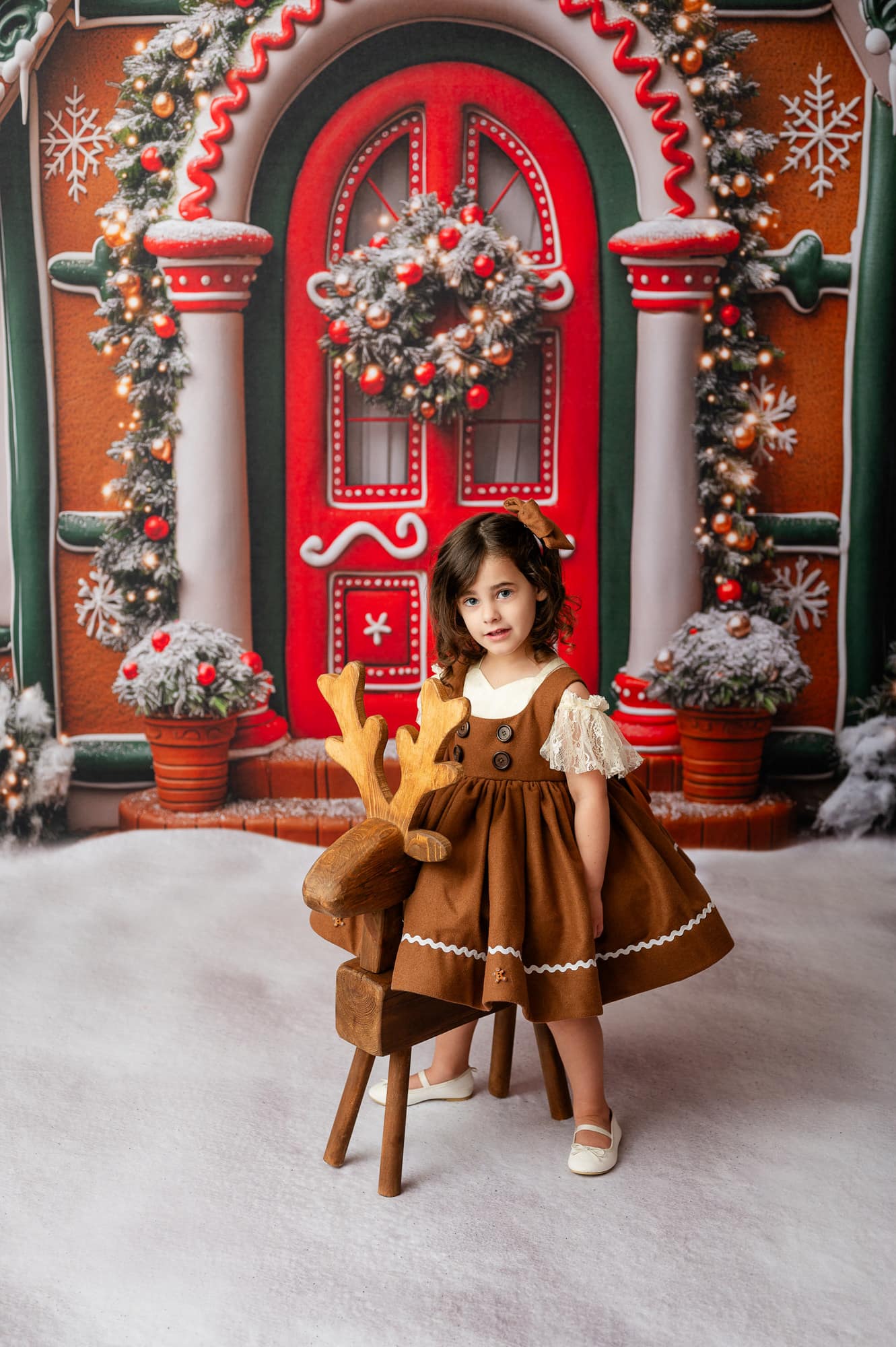 Toddler wearing a gingerbread apron 