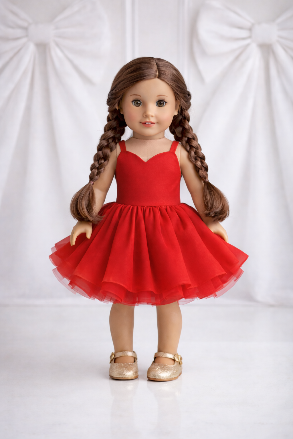 Doll wearing a red dress with a white background