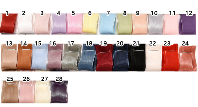 Set of 28 different colored ribbons arranged in a row on a white background.