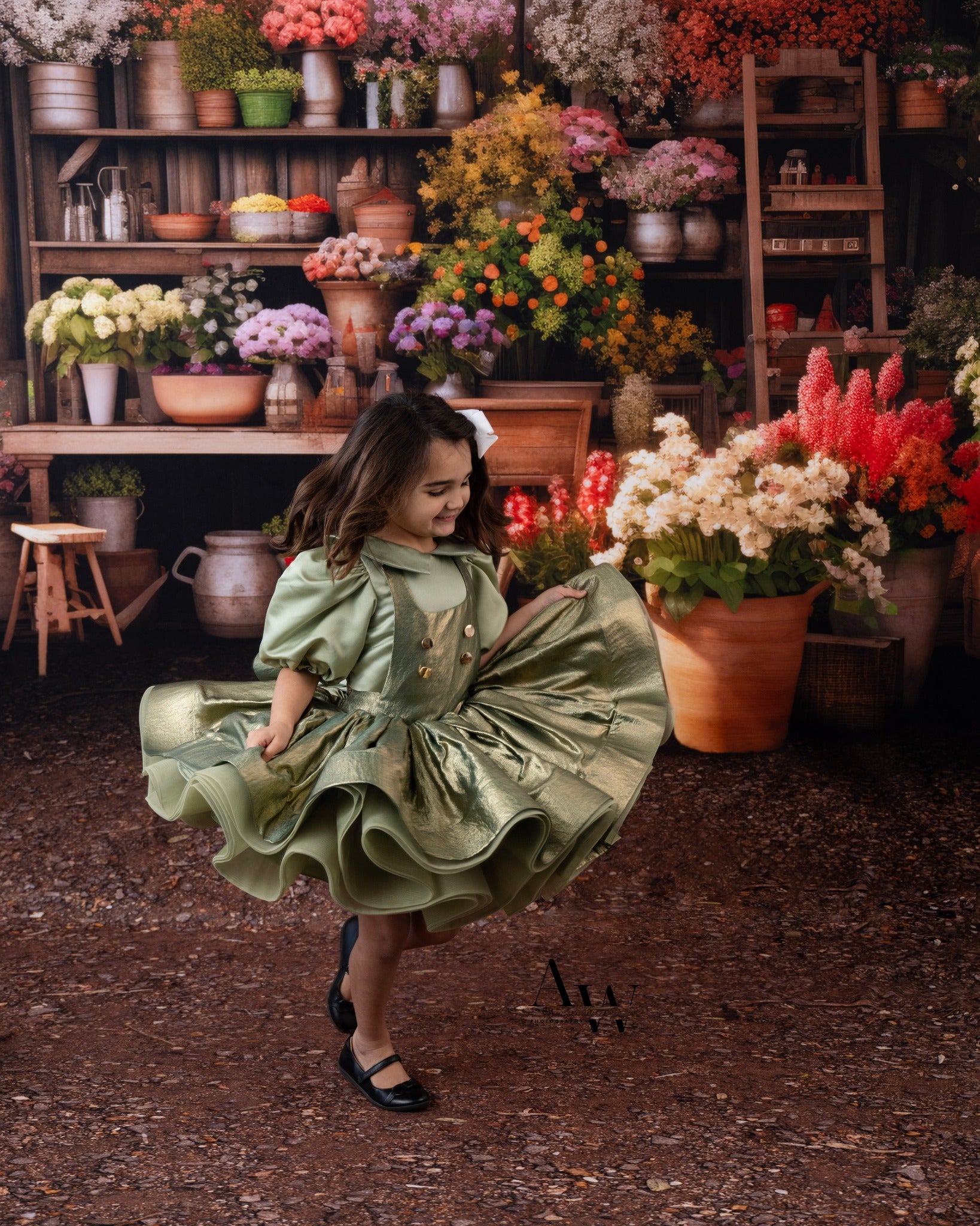 Little girl wearing a vintage inspired dress for a fruit stand photography backdrop- photography session.