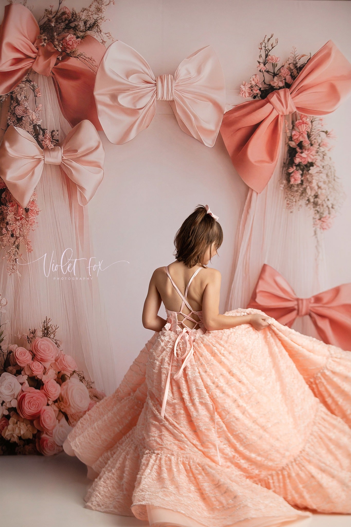 "Intricate floral details add depth and texture to the Rosette Reverie gown’s elegant design."
