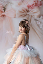 side profile of girl wearing a rainbow inspired gown