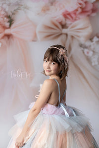 side profile of girl wearing a rainbow inspired gown