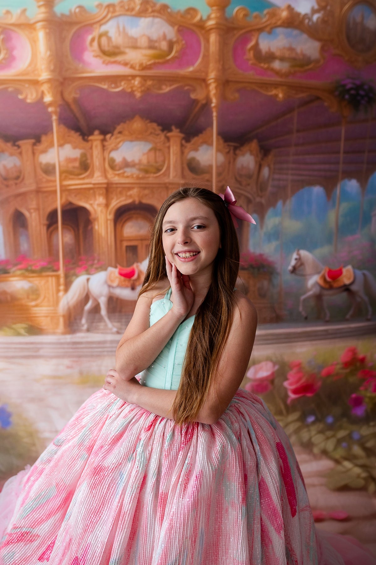 "Close-up of the Cotton Candy Dream gown’s ruffled pastel tulle and intricate floral headpiece, perfect for a whimsical photoshoot."

