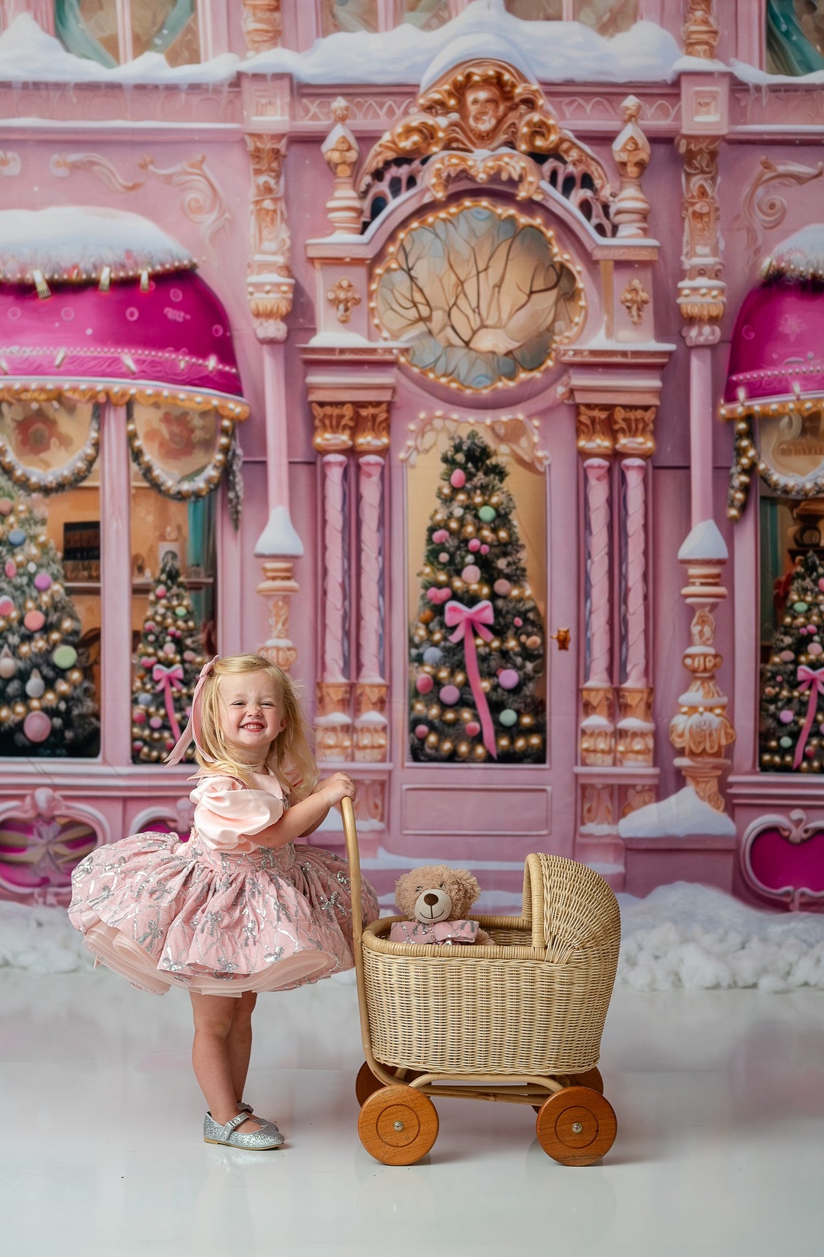 "Editorial-style portrait of a child wearing the Velvet Whimsy Bows Apron Dress, featuring a soft velvet skirt and silver embroidered bows, styled with a puff sleeve detachable bodice."

