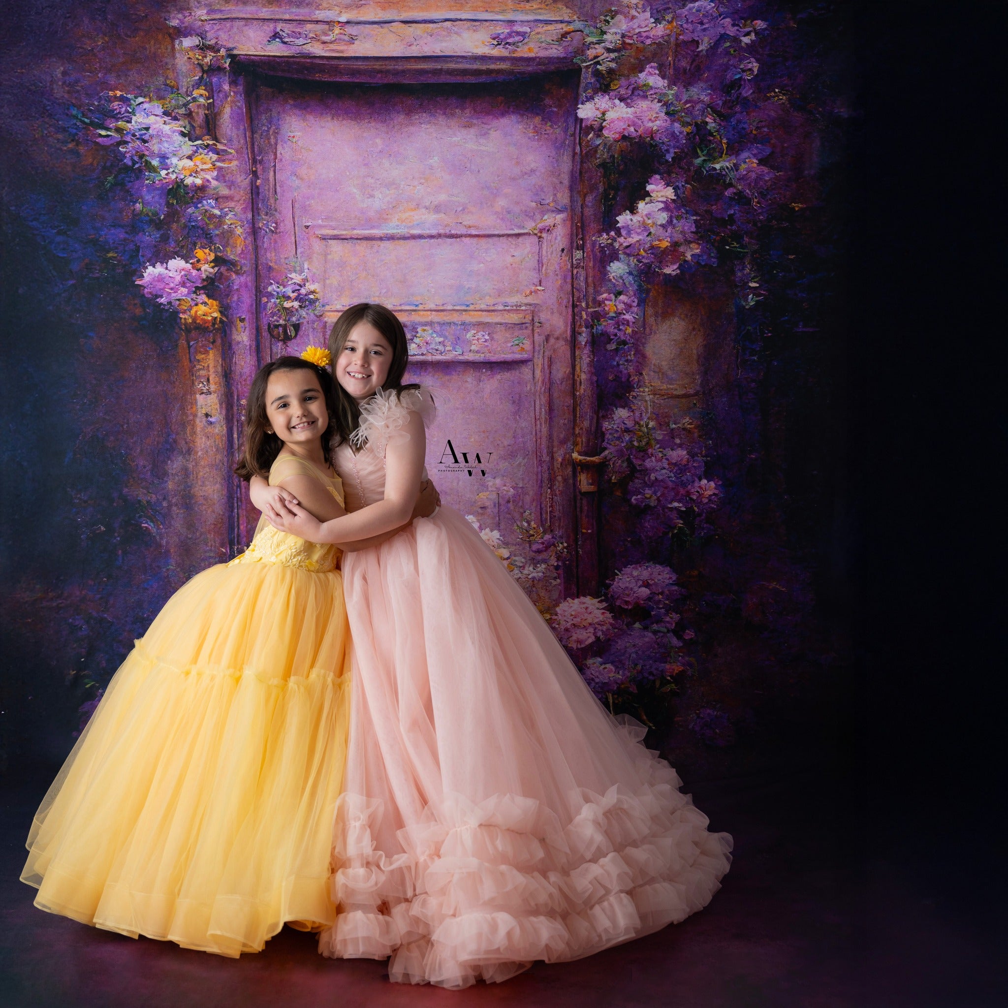 "Monreau gown in peachy pink tulle with floor-length ruffled skirt and feather details"

